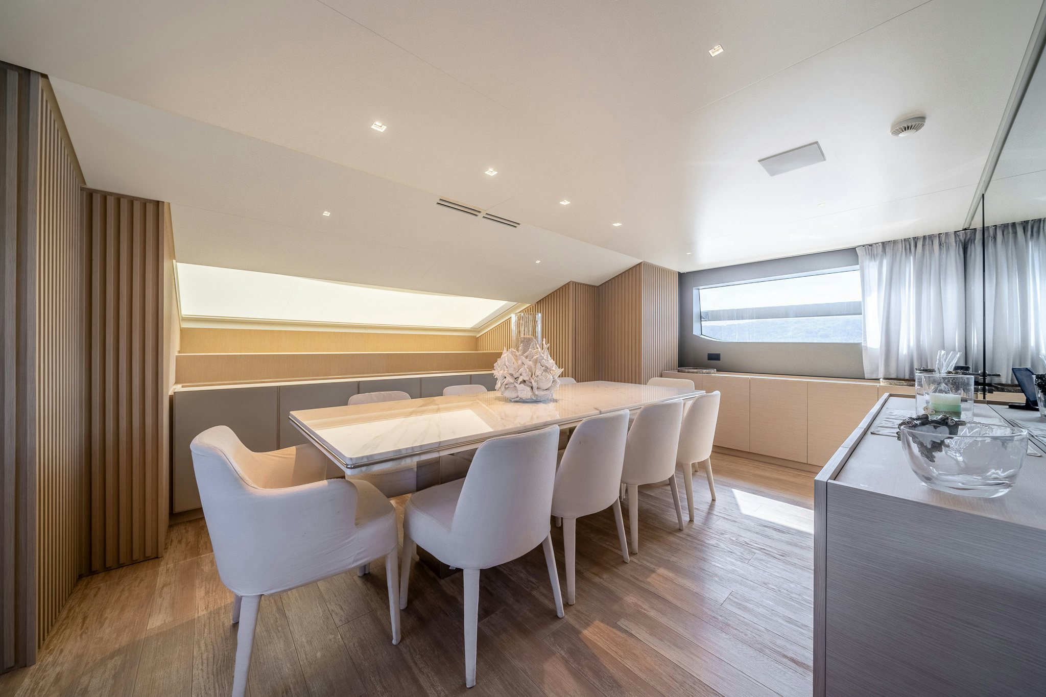 a large kitchen with a dining table aboard BLUE ANGEL Yacht for Sale