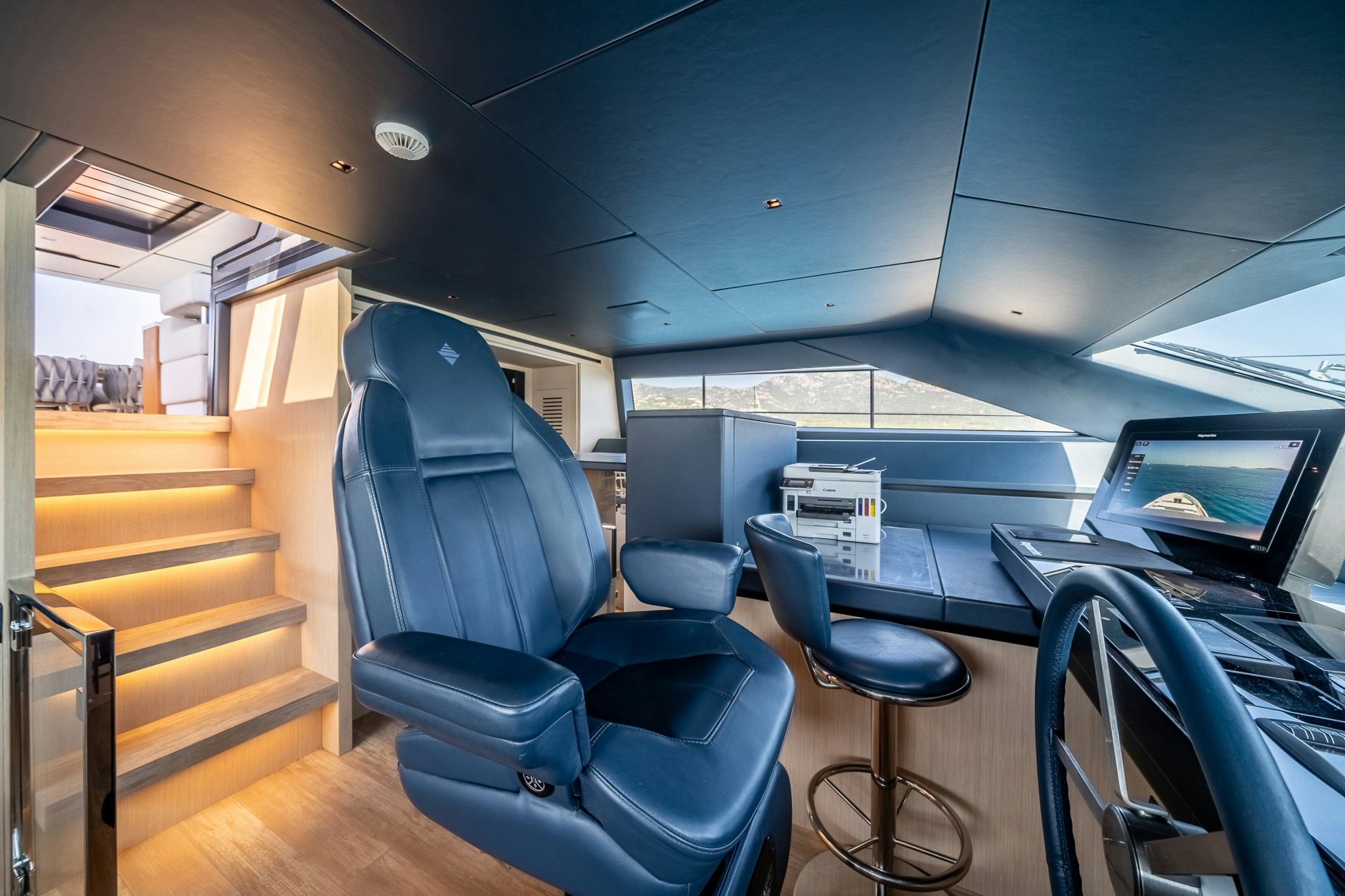 a room with a desk and chairs aboard BLUE ANGEL Yacht for Sale