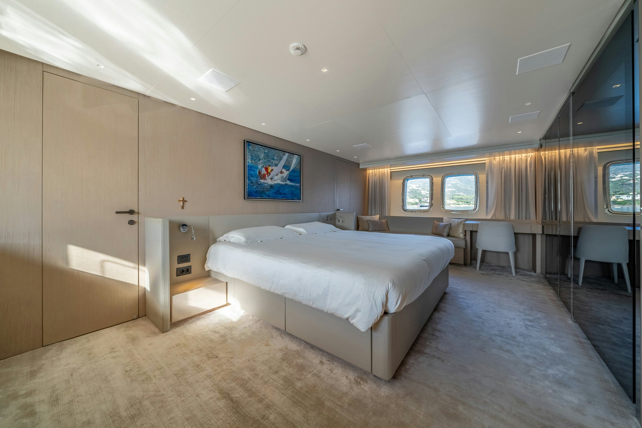 a room with a couple of beds aboard BLUE ANGEL Yacht for Sale