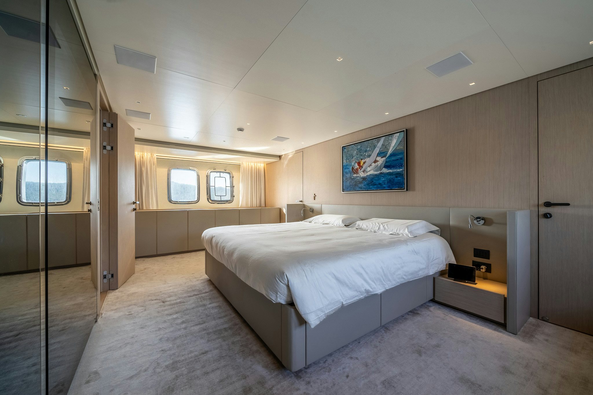 a room with a bed and a door aboard BLUE ANGEL Yacht for Sale