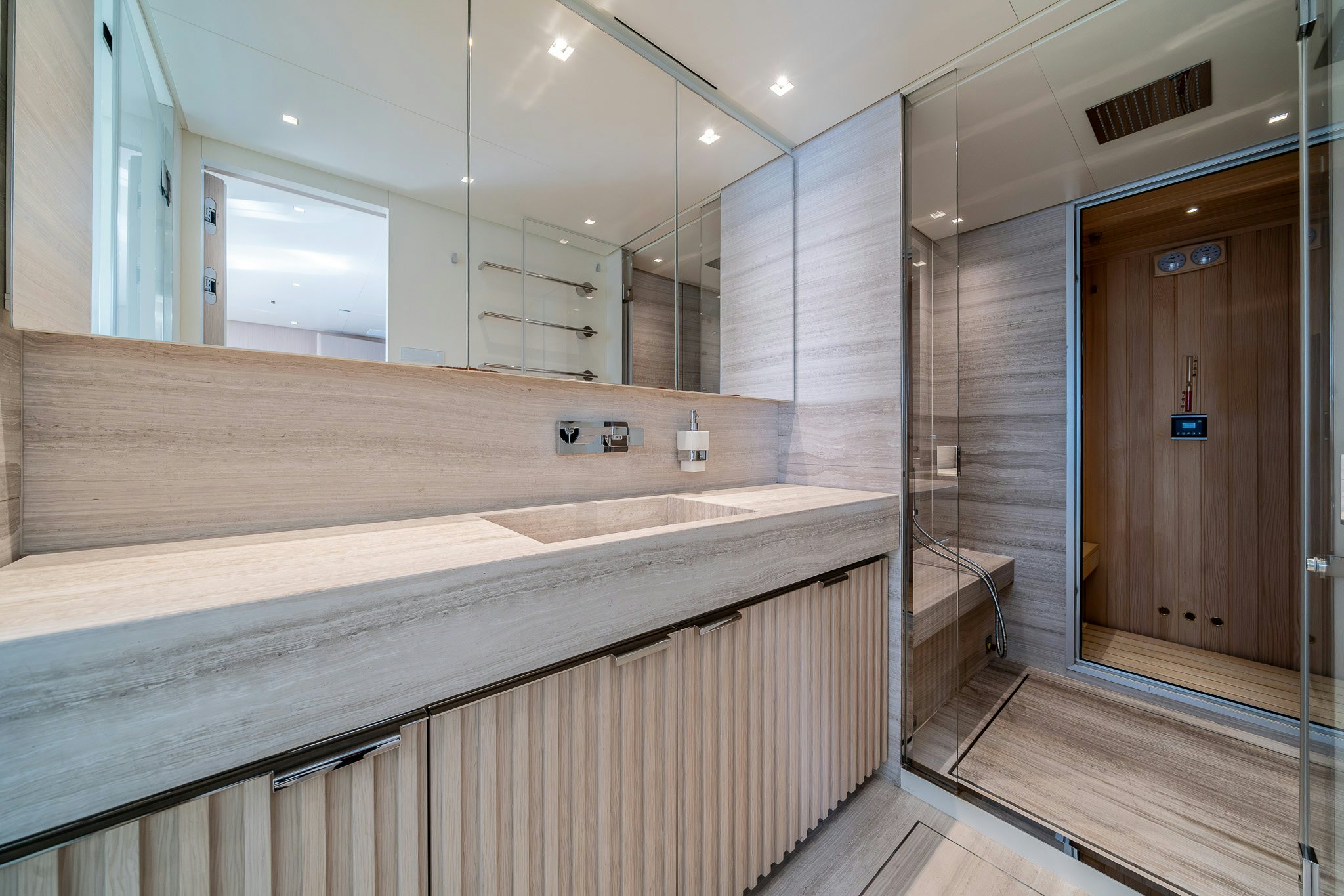 a bathroom with a large mirror aboard BLUE ANGEL Yacht for Sale