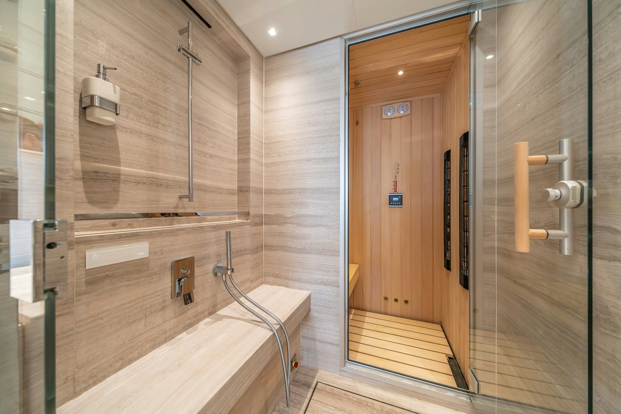 a bathroom with a glass shower aboard BLUE ANGEL Yacht for Sale