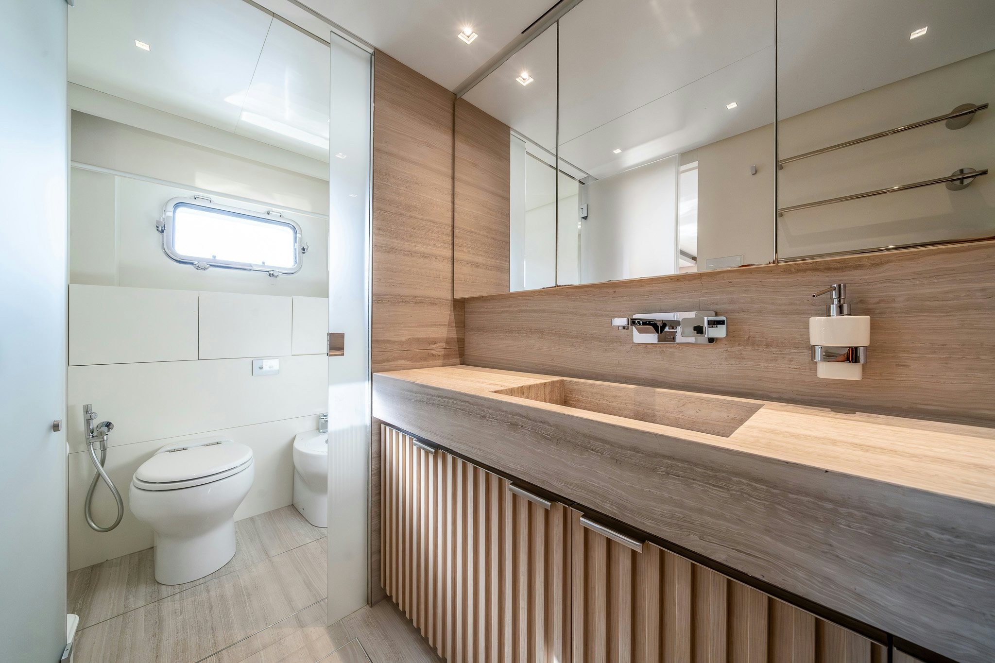 a bathroom with a sink and a toilet aboard BLUE ANGEL Yacht for Sale