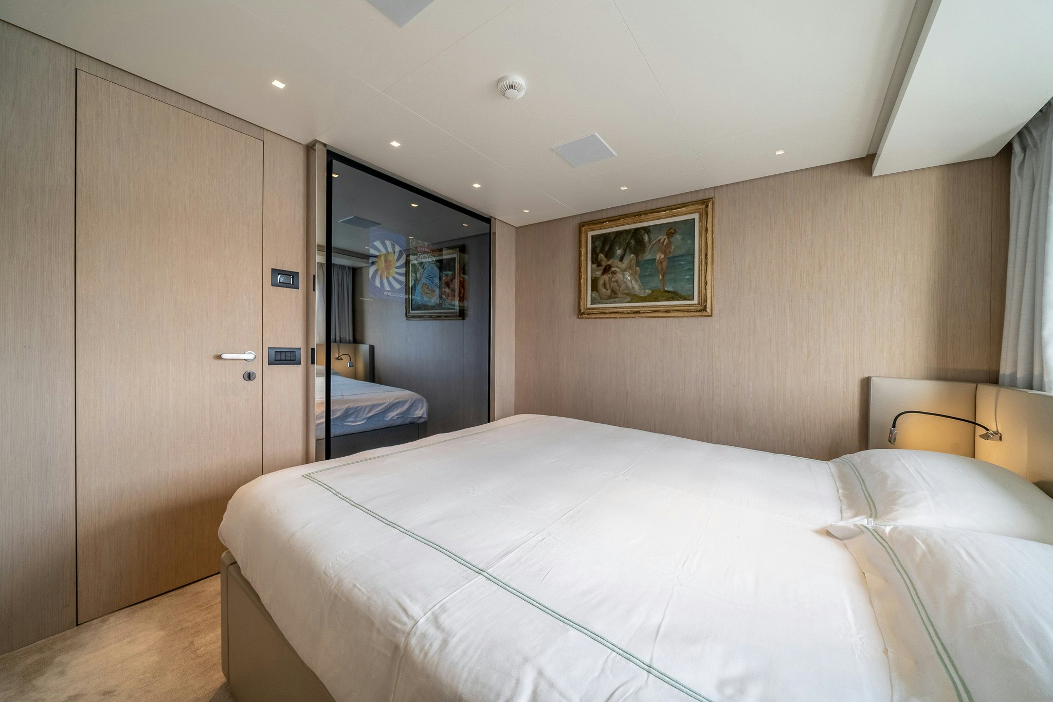 a bedroom with a bed and a closet aboard BLUE ANGEL Yacht for Sale