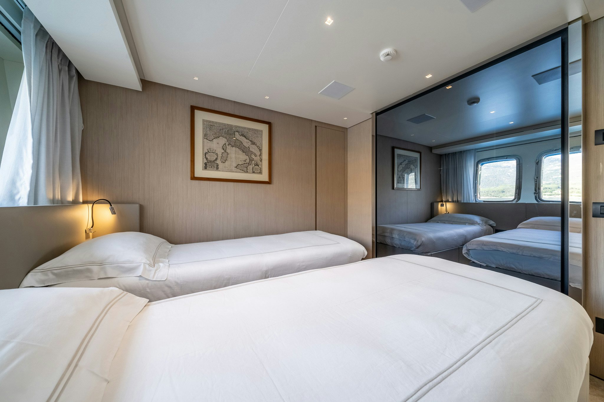 a hotel room with a bed and a window aboard BLUE ANGEL Yacht for Sale