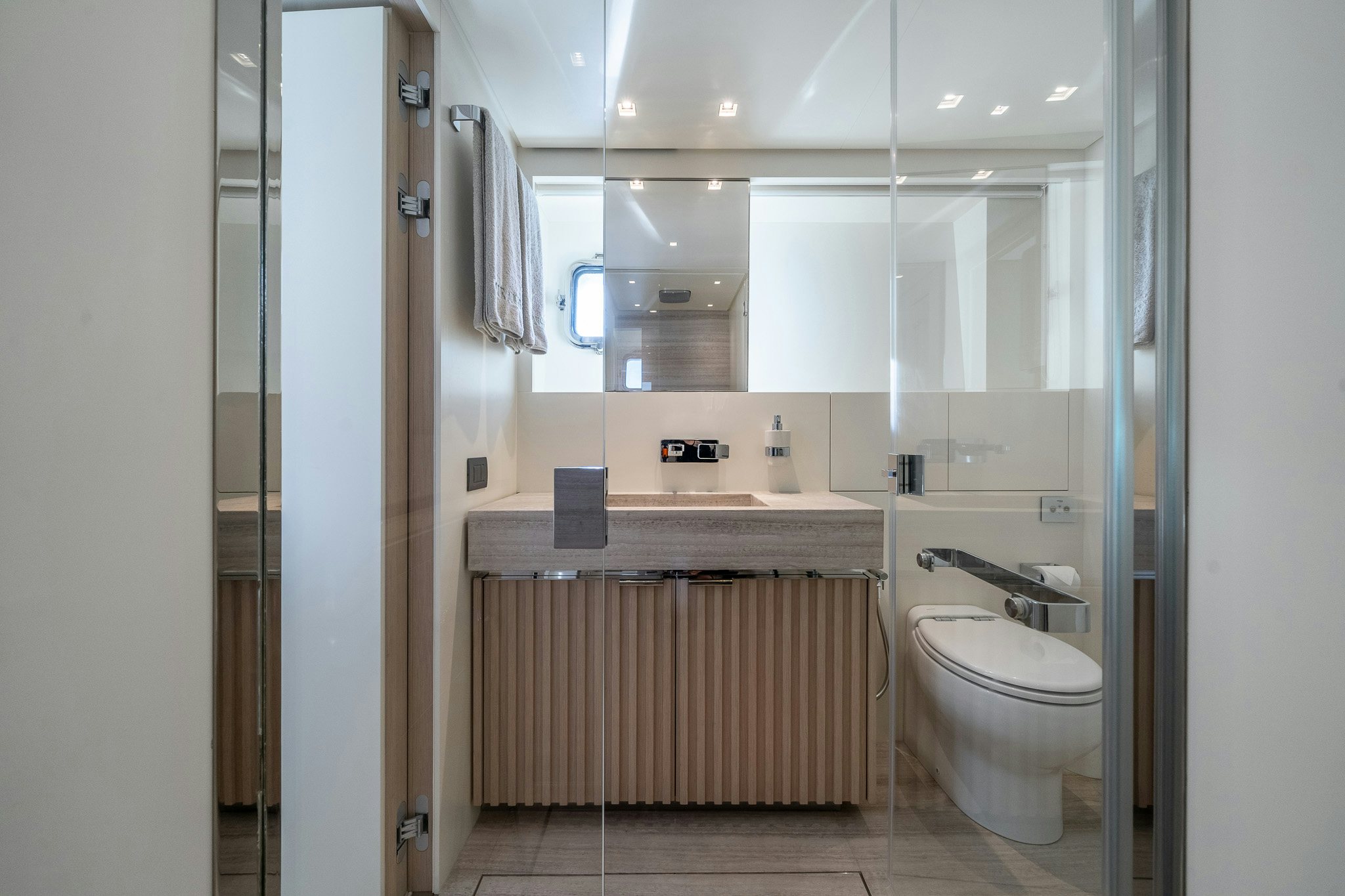 a bathroom with a sink and a toilet aboard BLUE ANGEL Yacht for Sale