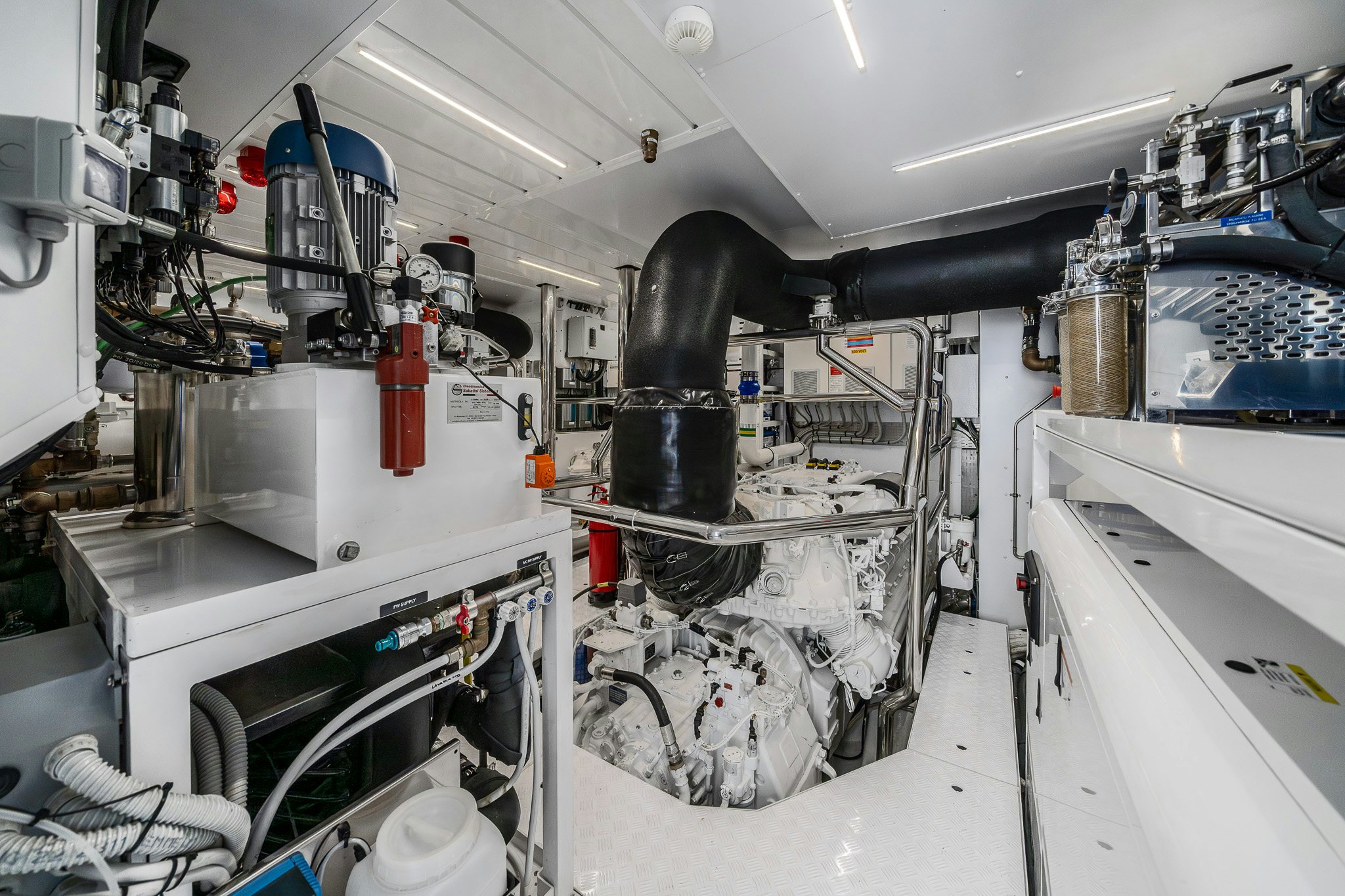 a large machine with a large black object on the side aboard BLUE ANGEL Yacht for Sale