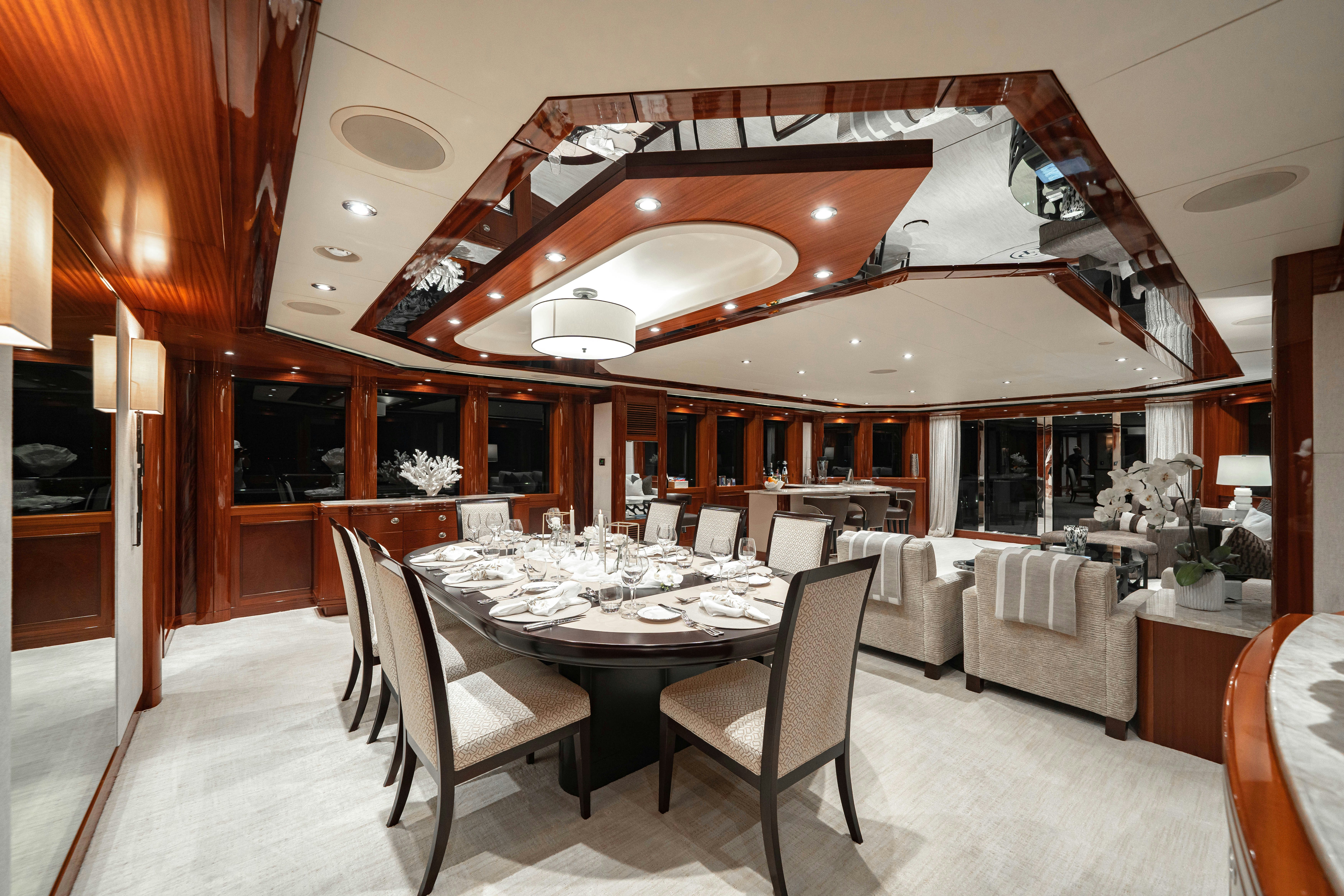 a dining room with a table and chairs aboard CHASING DAYLIGHT Yacht for Charter