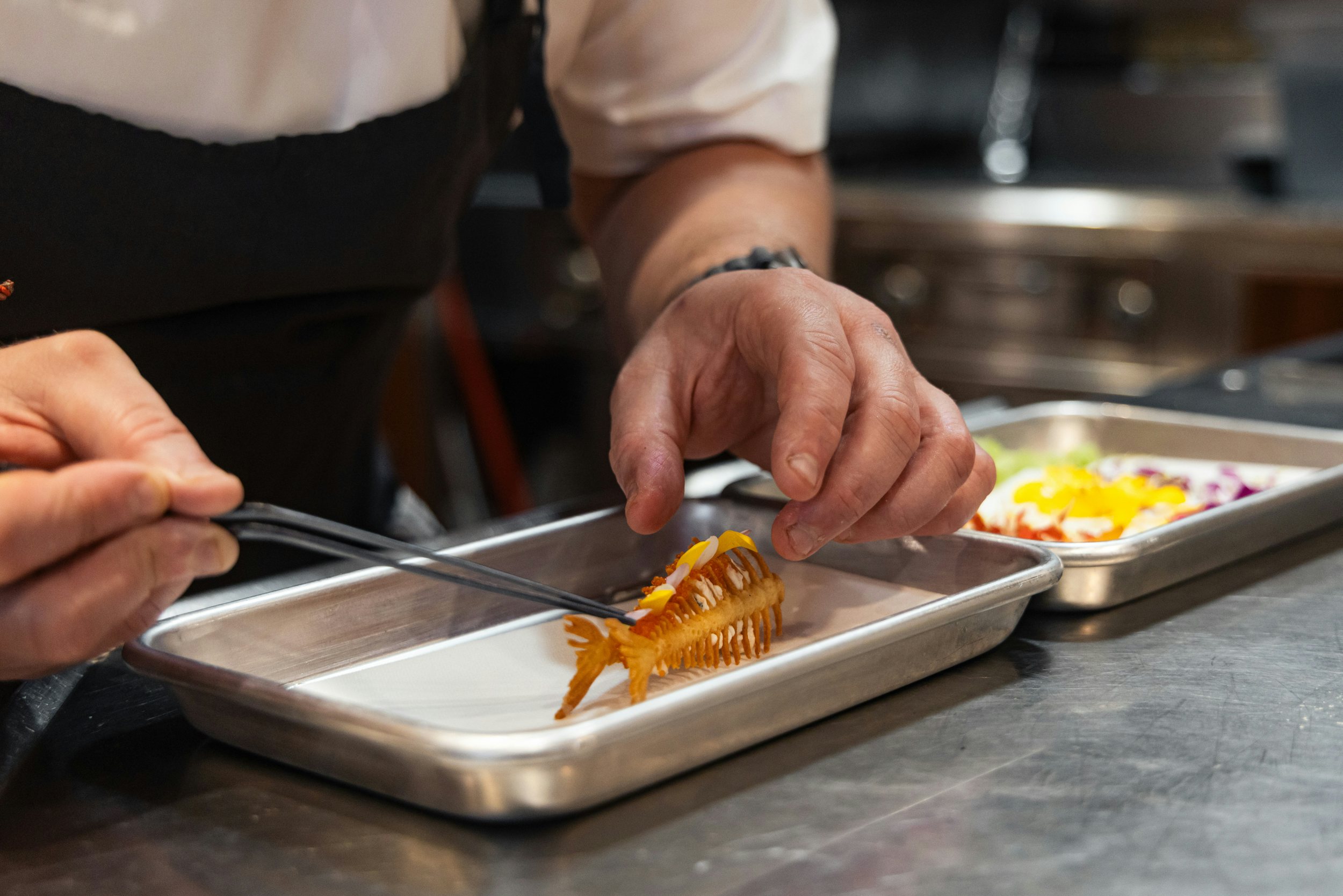 a person cutting a cake aboard CHASING DAYLIGHT Yacht for Charter