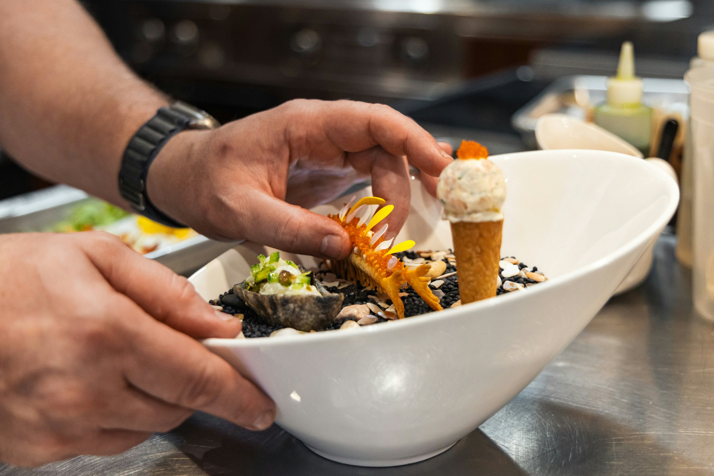 hands holding a bowl of food aboard CHASING DAYLIGHT Yacht for Charter