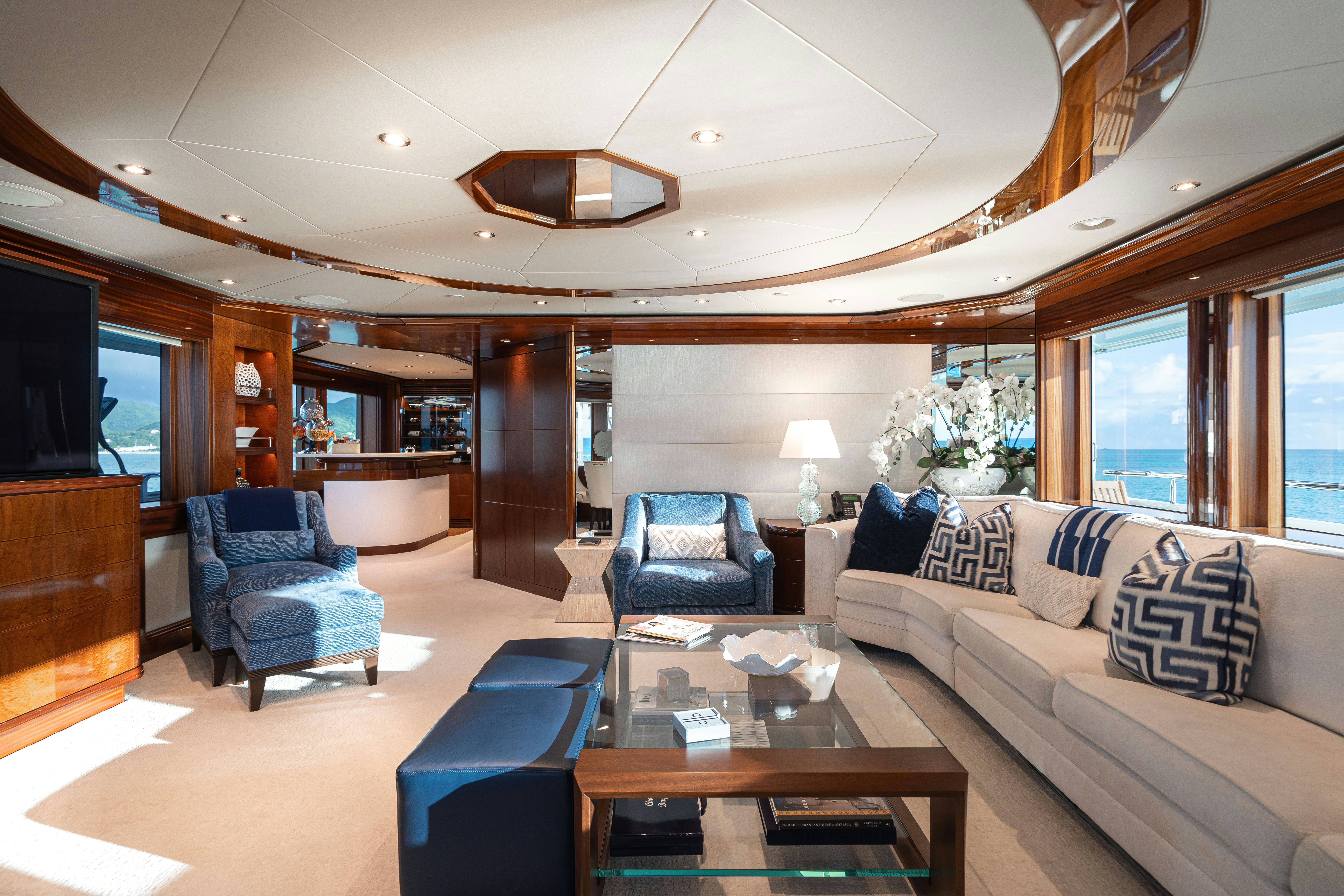 a living room with a couch and a coffee table aboard CHASING DAYLIGHT Yacht for Charter