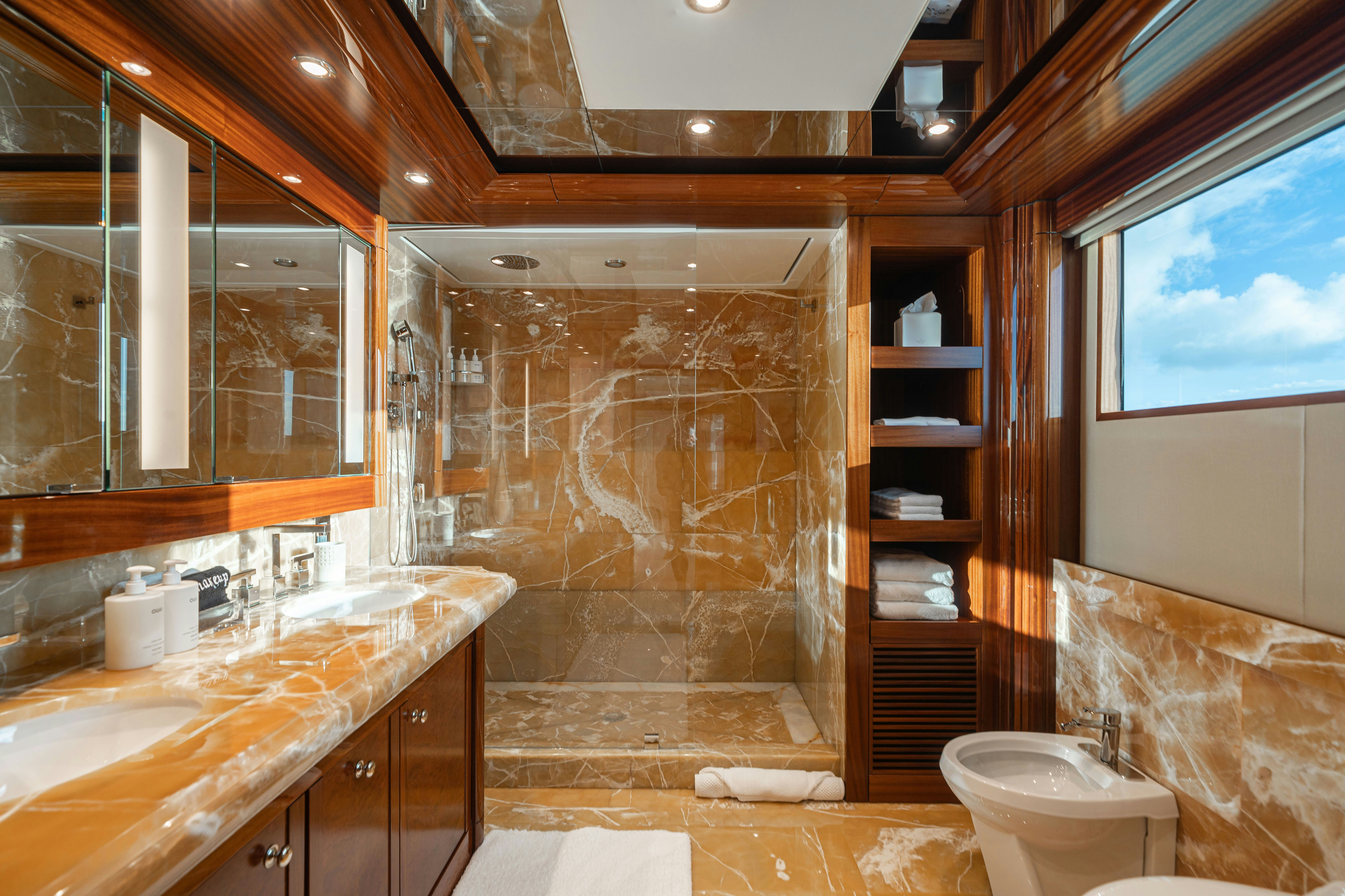 a bathroom with a glass shower aboard CHASING DAYLIGHT Yacht for Charter