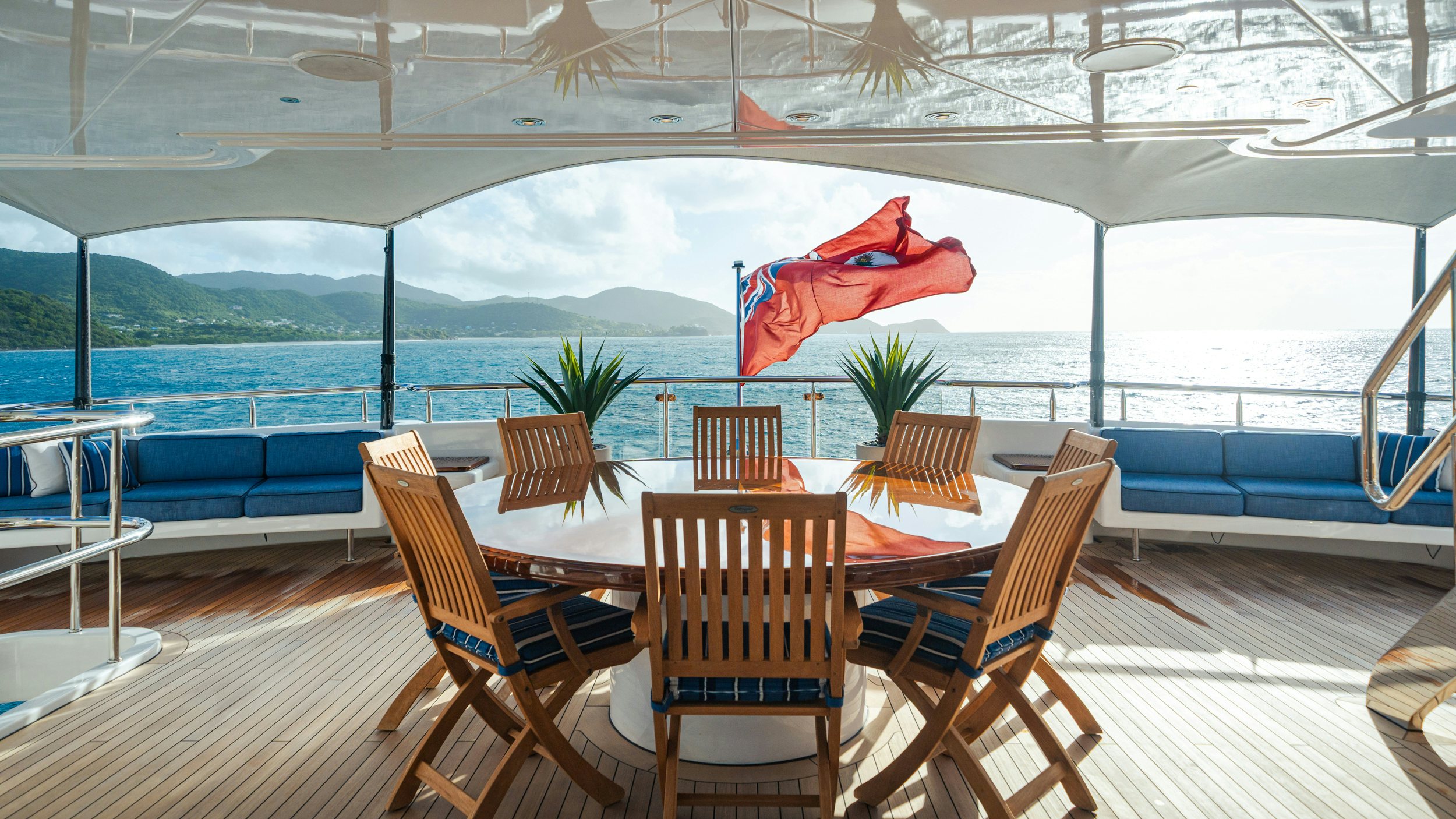 a table with chairs on it aboard CHASING DAYLIGHT Yacht for Charter