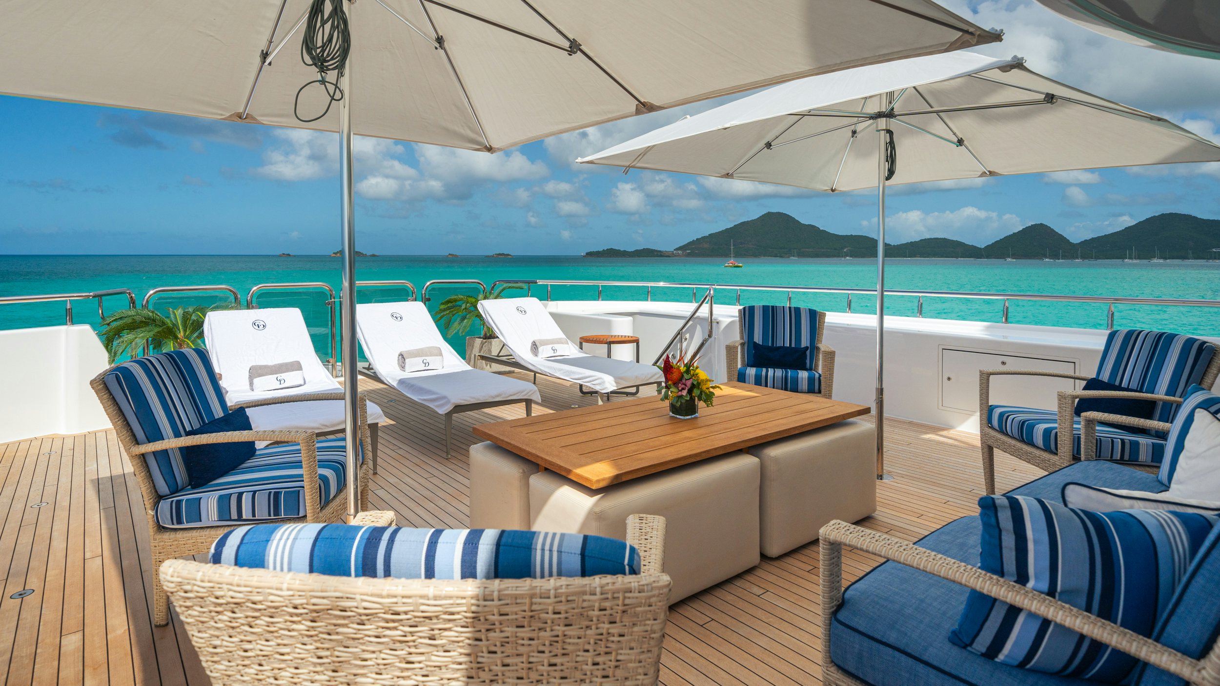 a patio with a table and chairs aboard CHASING DAYLIGHT Yacht for Charter