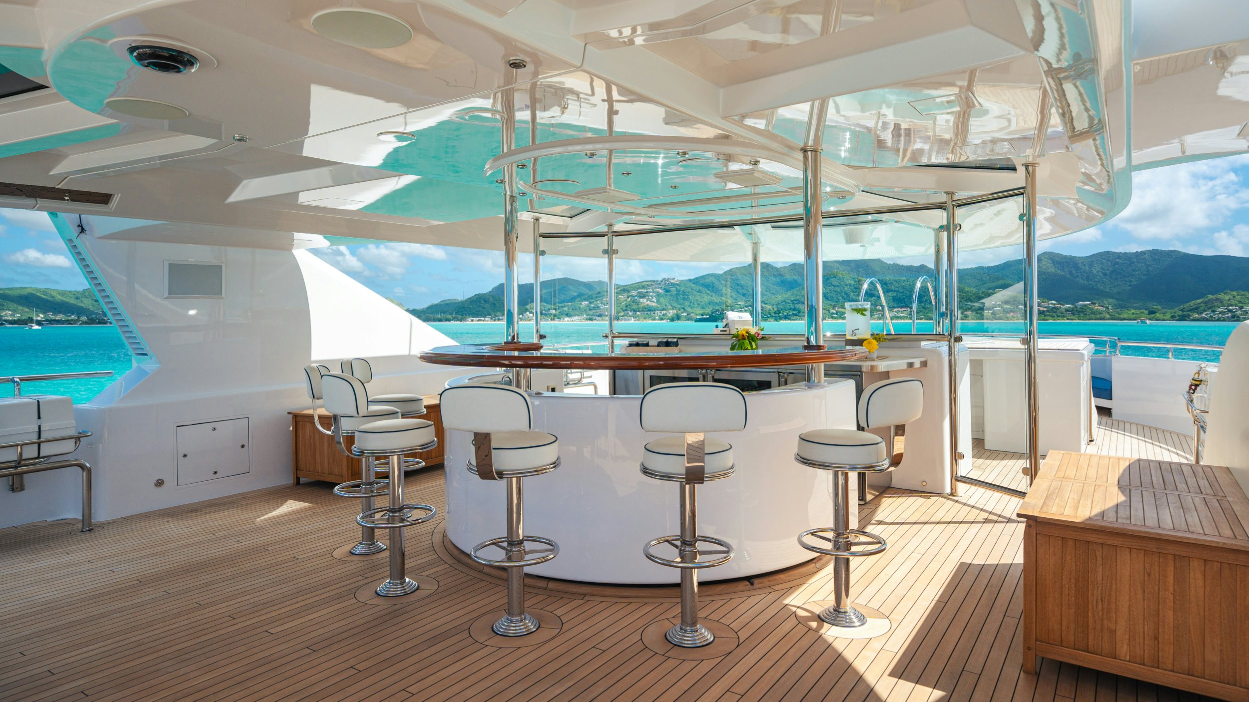 a room with tables and chairs aboard CHASING DAYLIGHT Yacht for Charter