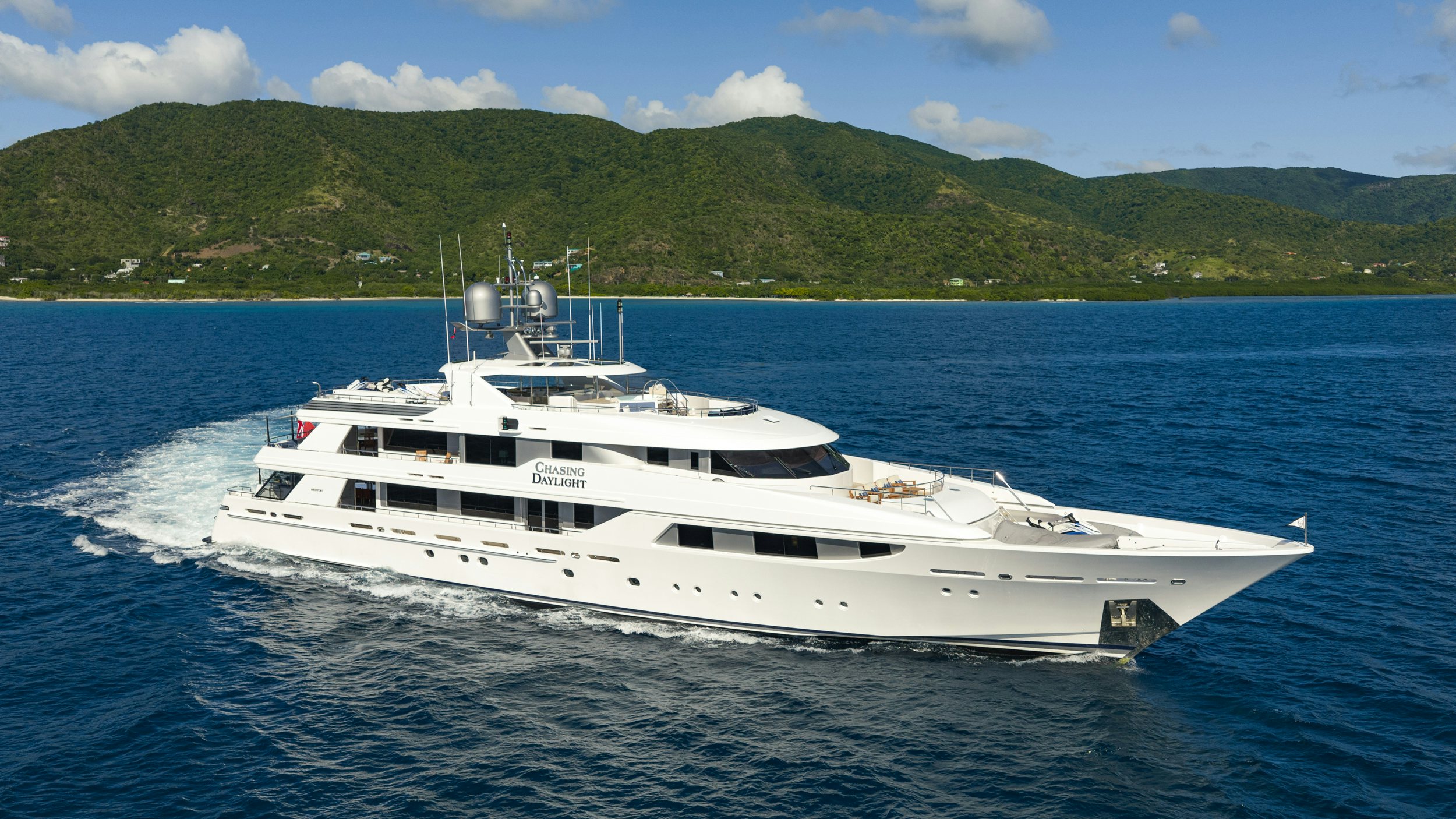 a white yacht on the water aboard CHASING DAYLIGHT Yacht for Charter
