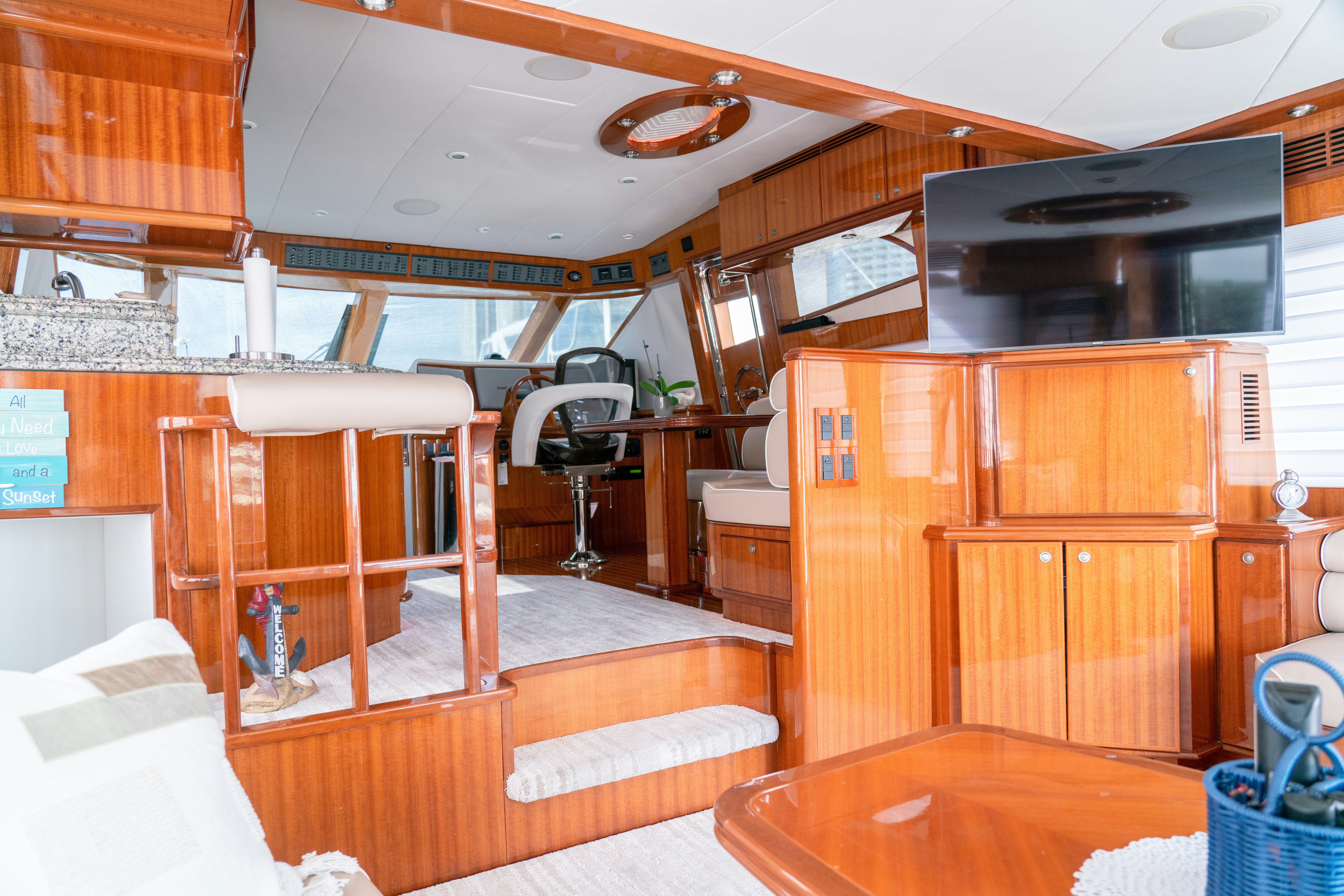 a room with wooden furniture aboard YOLO Yacht for Sale