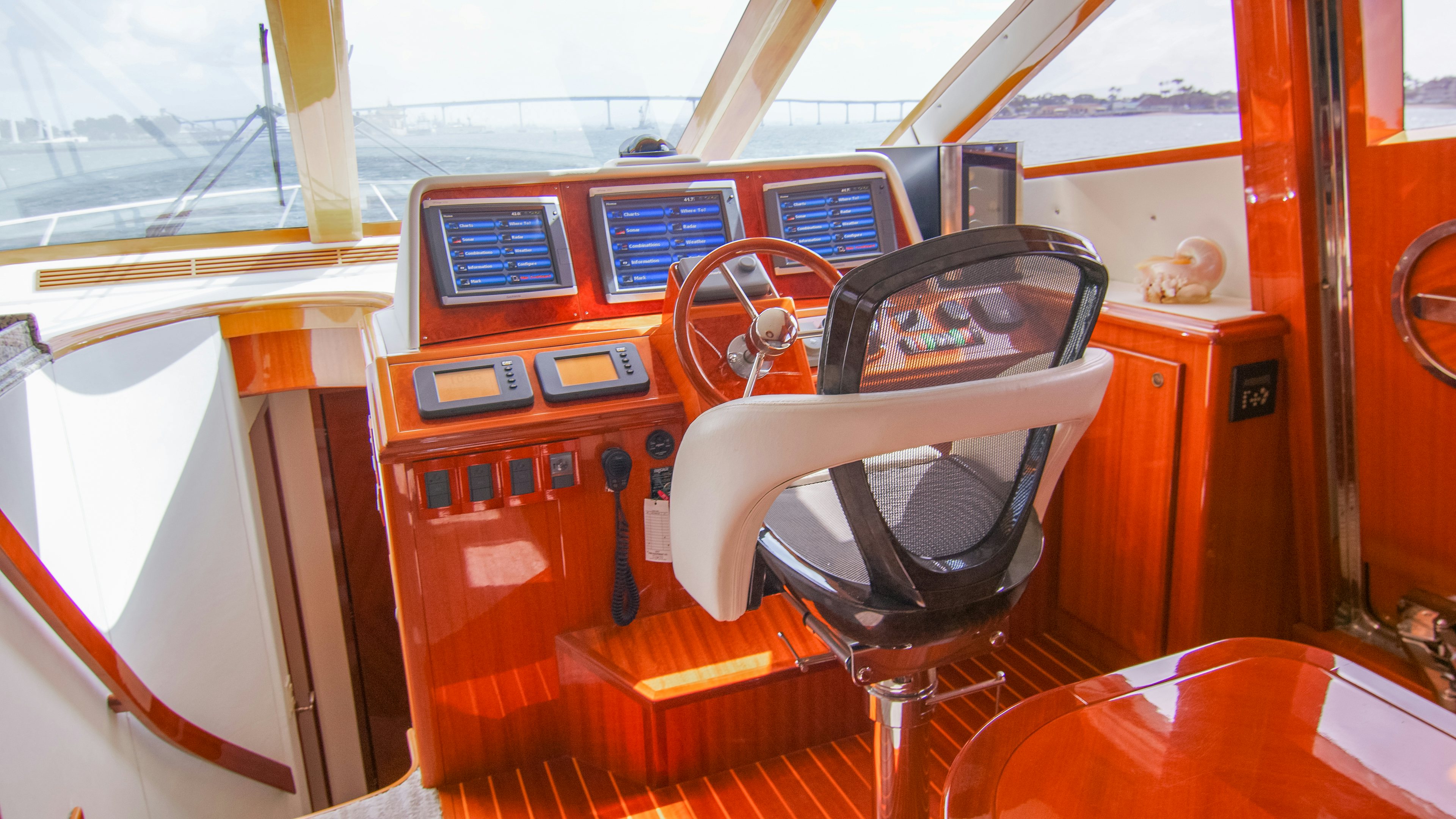 an orange and black car aboard YOLO Yacht for Sale