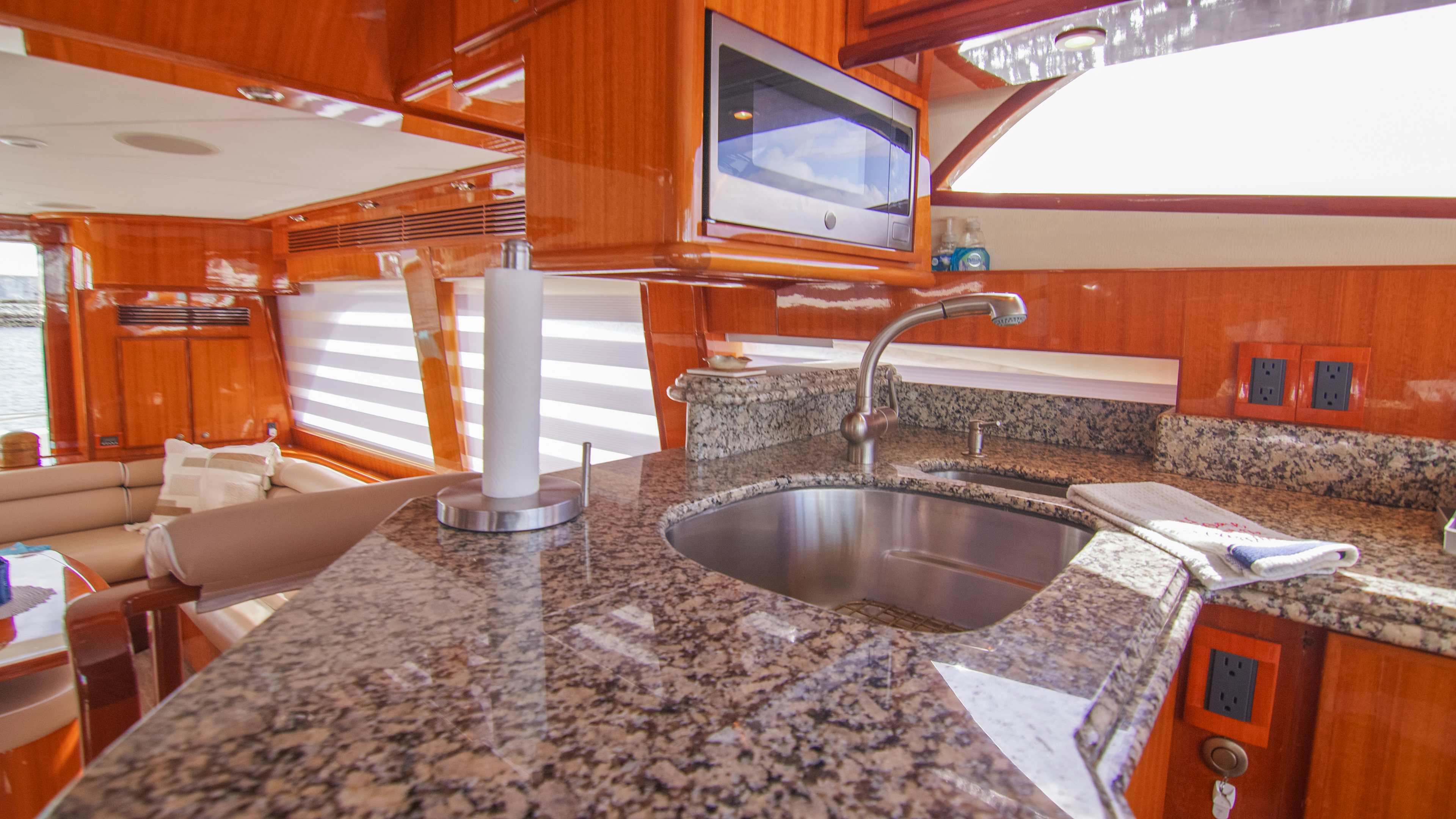 a kitchen with a large marble counter top aboard YOLO Yacht for Sale
