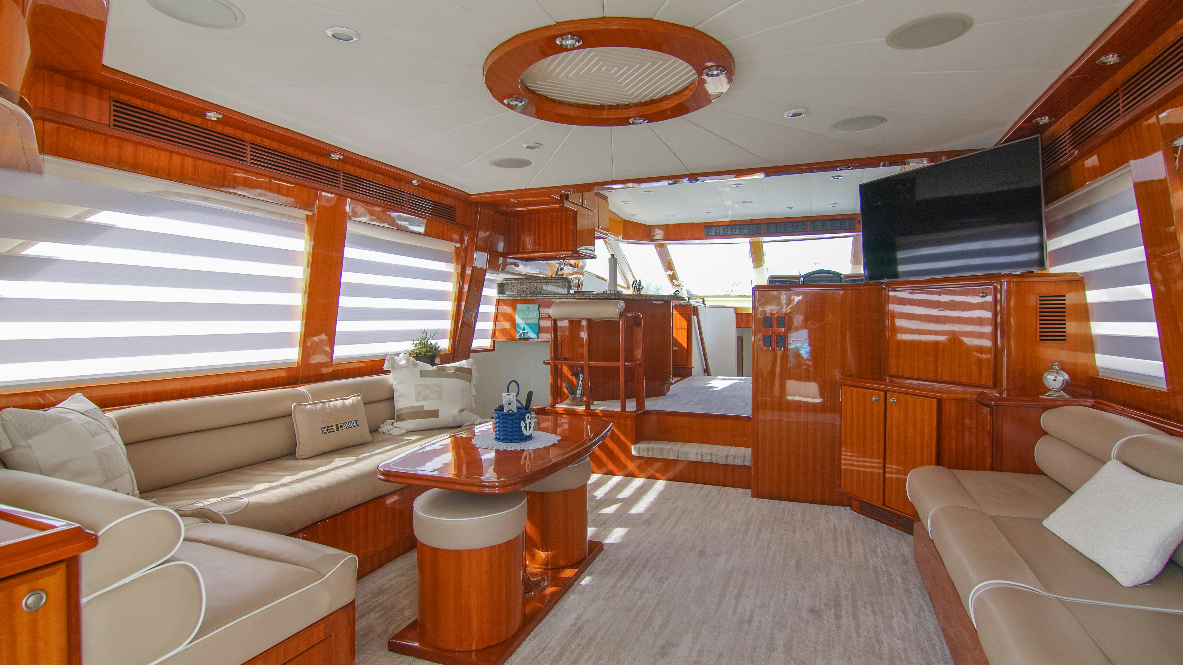 a room with a couch and a table aboard YOLO Yacht for Sale