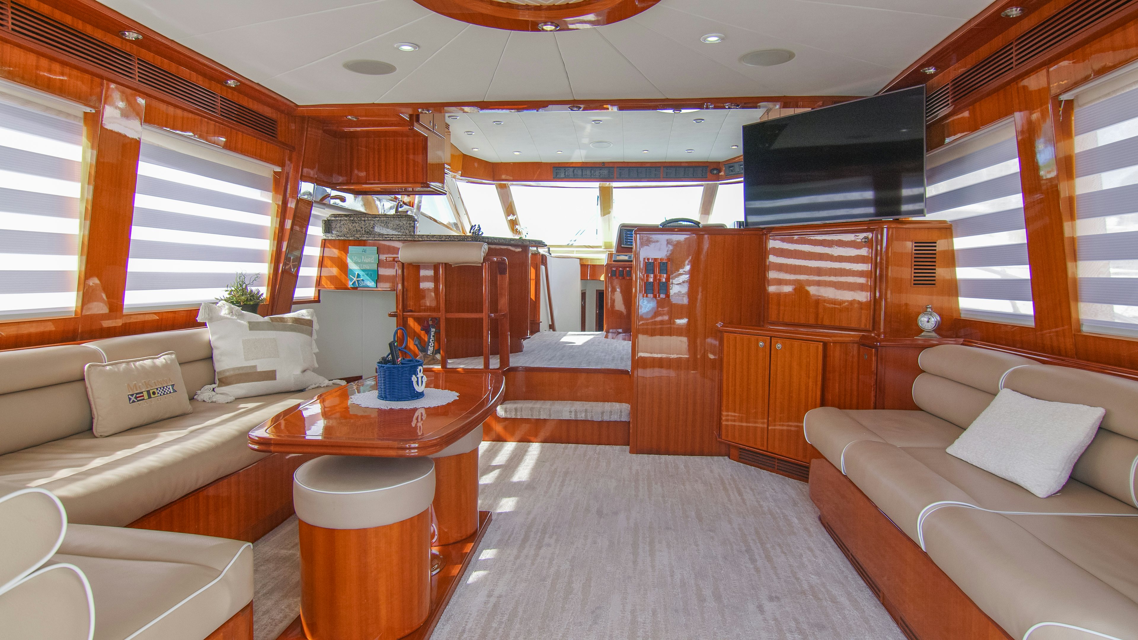 a living room with a couch and a coffee table aboard YOLO Yacht for Sale