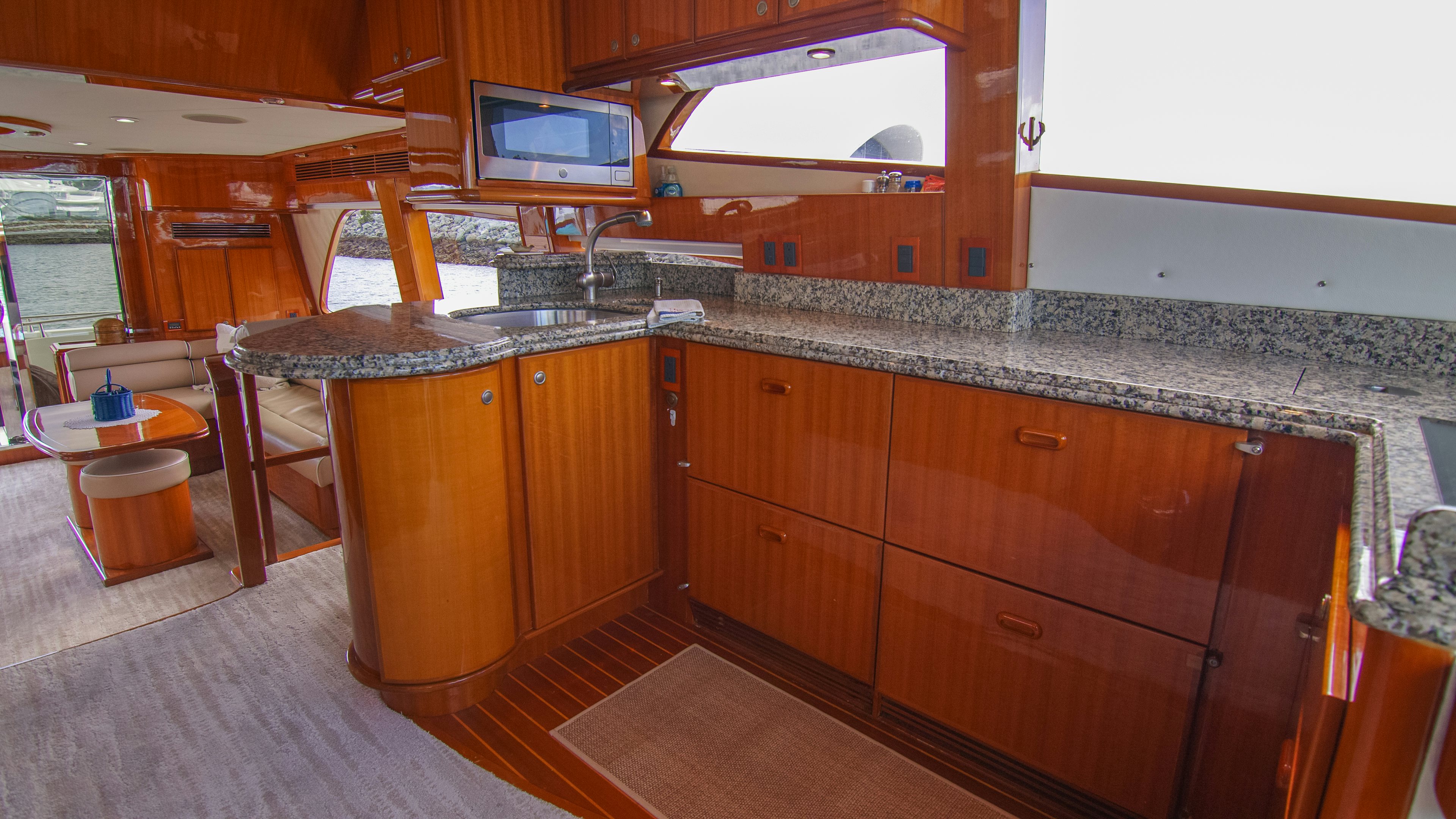 a kitchen with a large island aboard YOLO Yacht for Sale