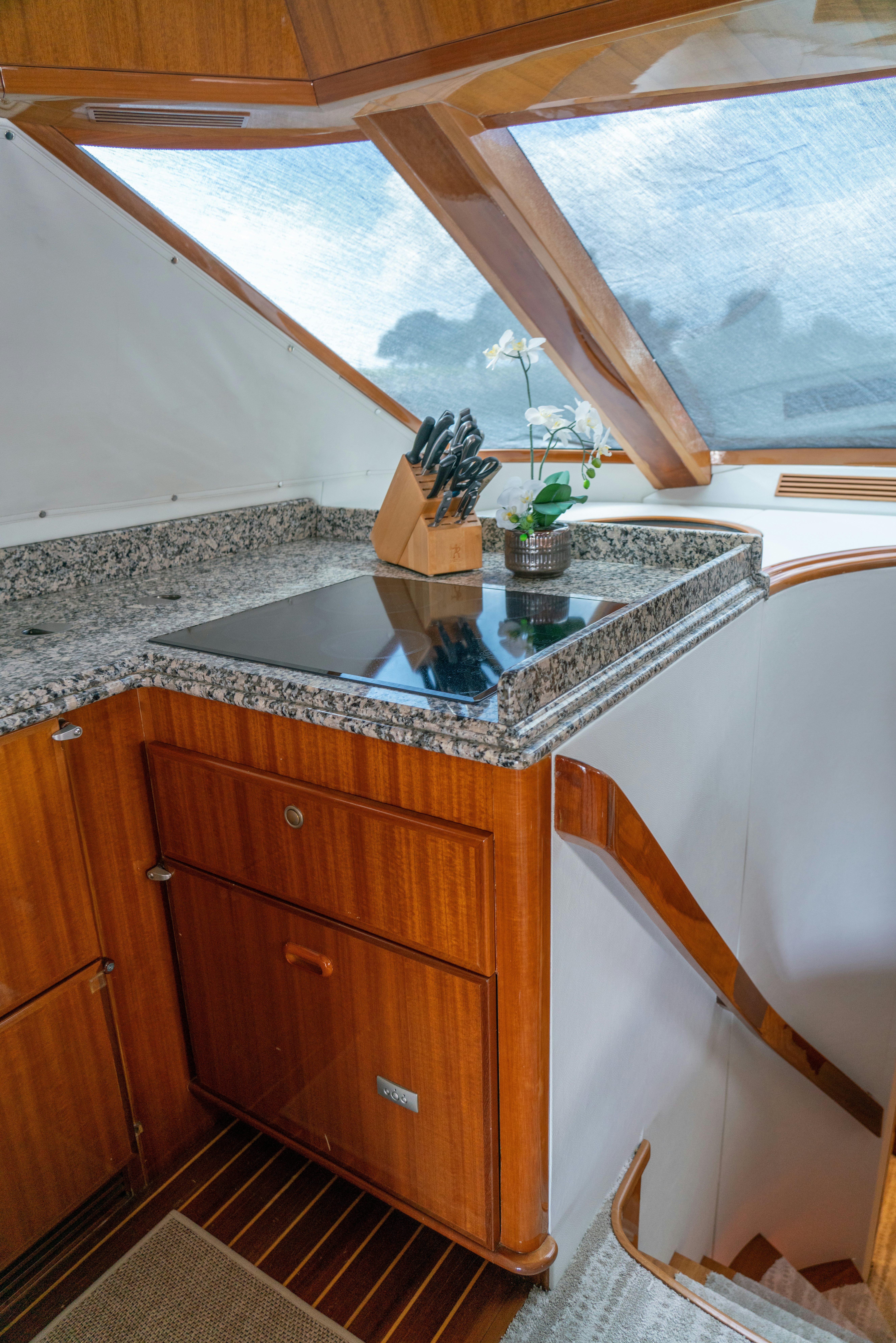 a kitchen with a large window aboard YOLO Yacht for Sale