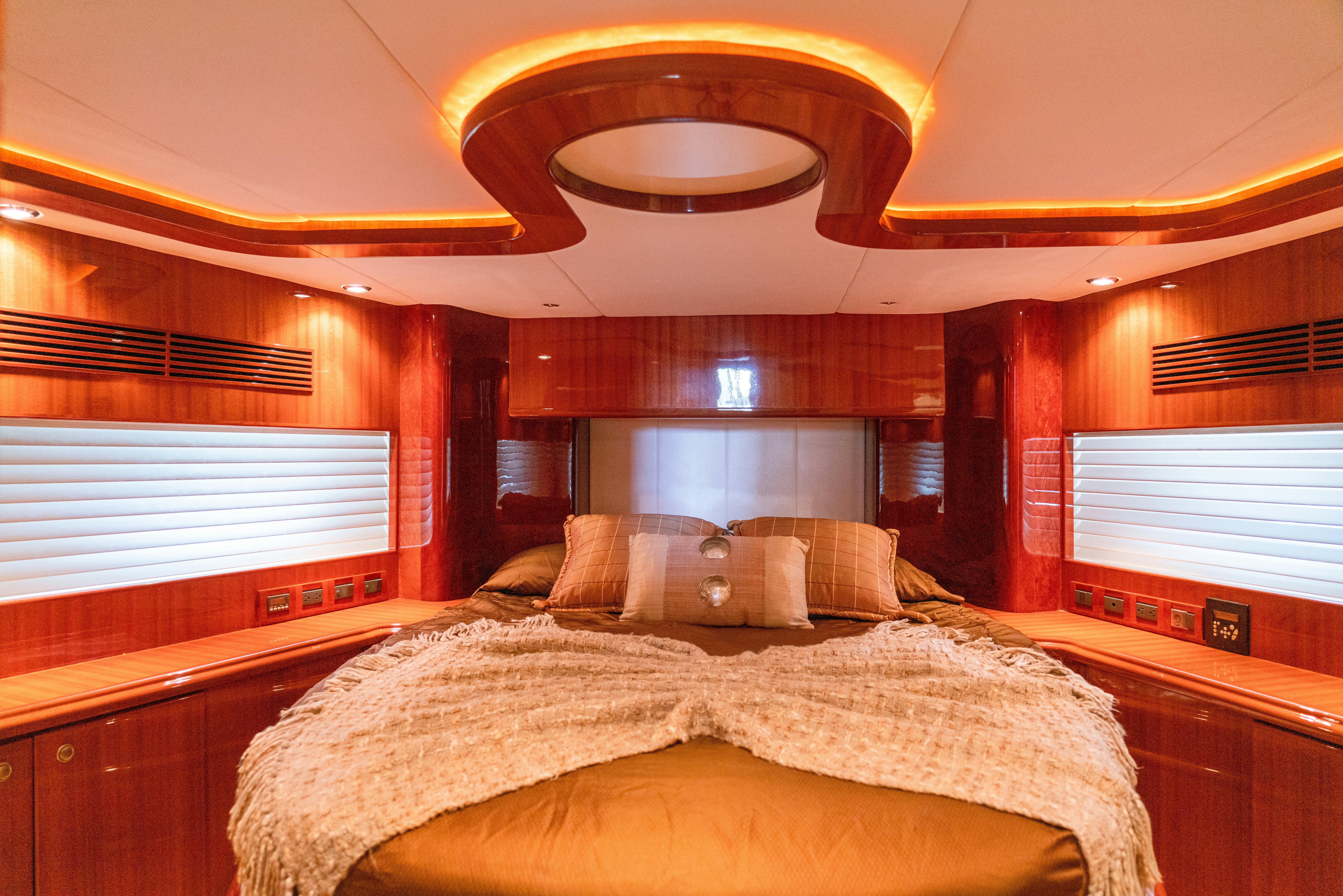 a room with a bed and a window aboard YOLO Yacht for Sale