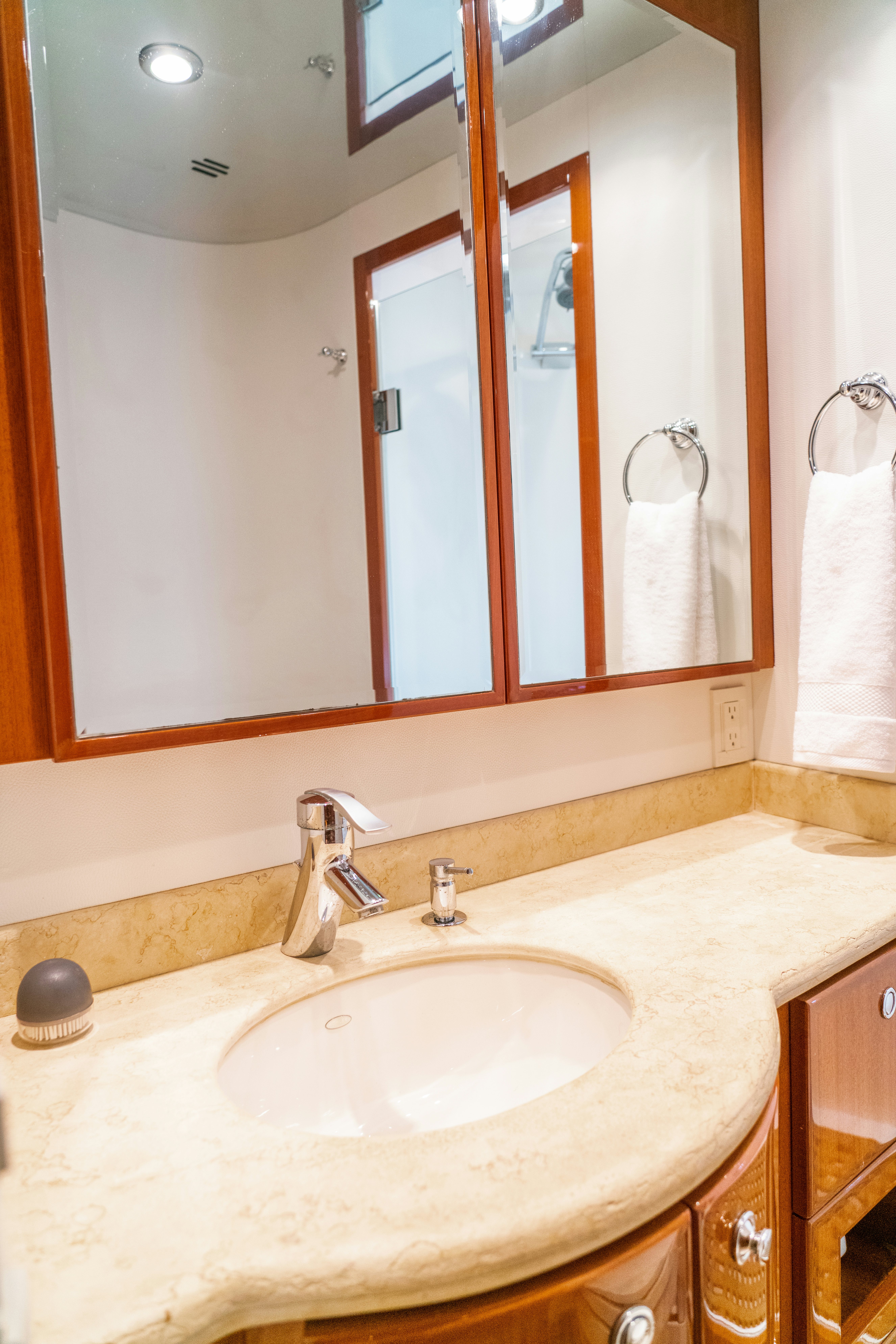 a bathroom with a large mirror aboard YOLO Yacht for Sale
