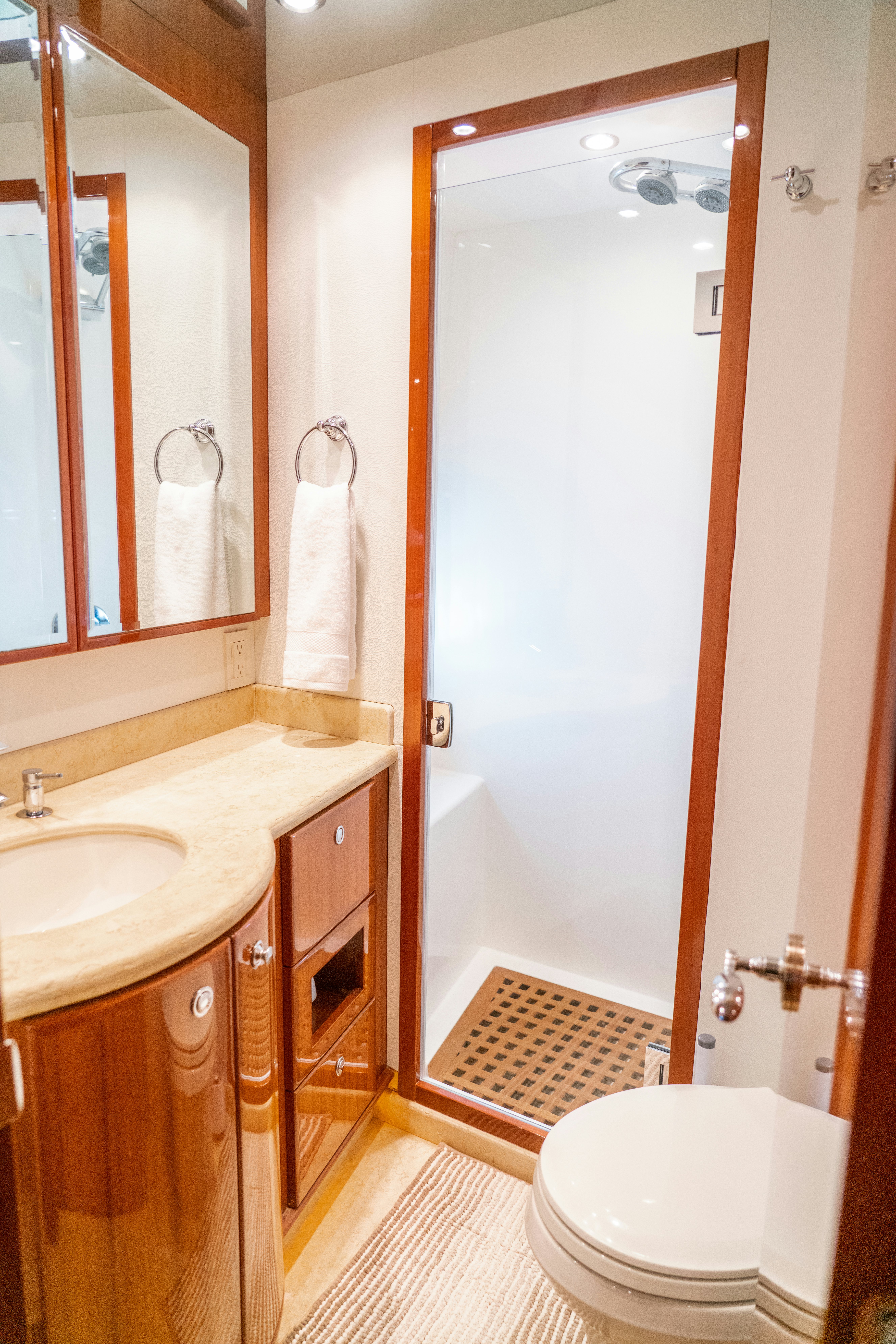 a bathroom with a sink toilet and a shower aboard YOLO Yacht for Sale