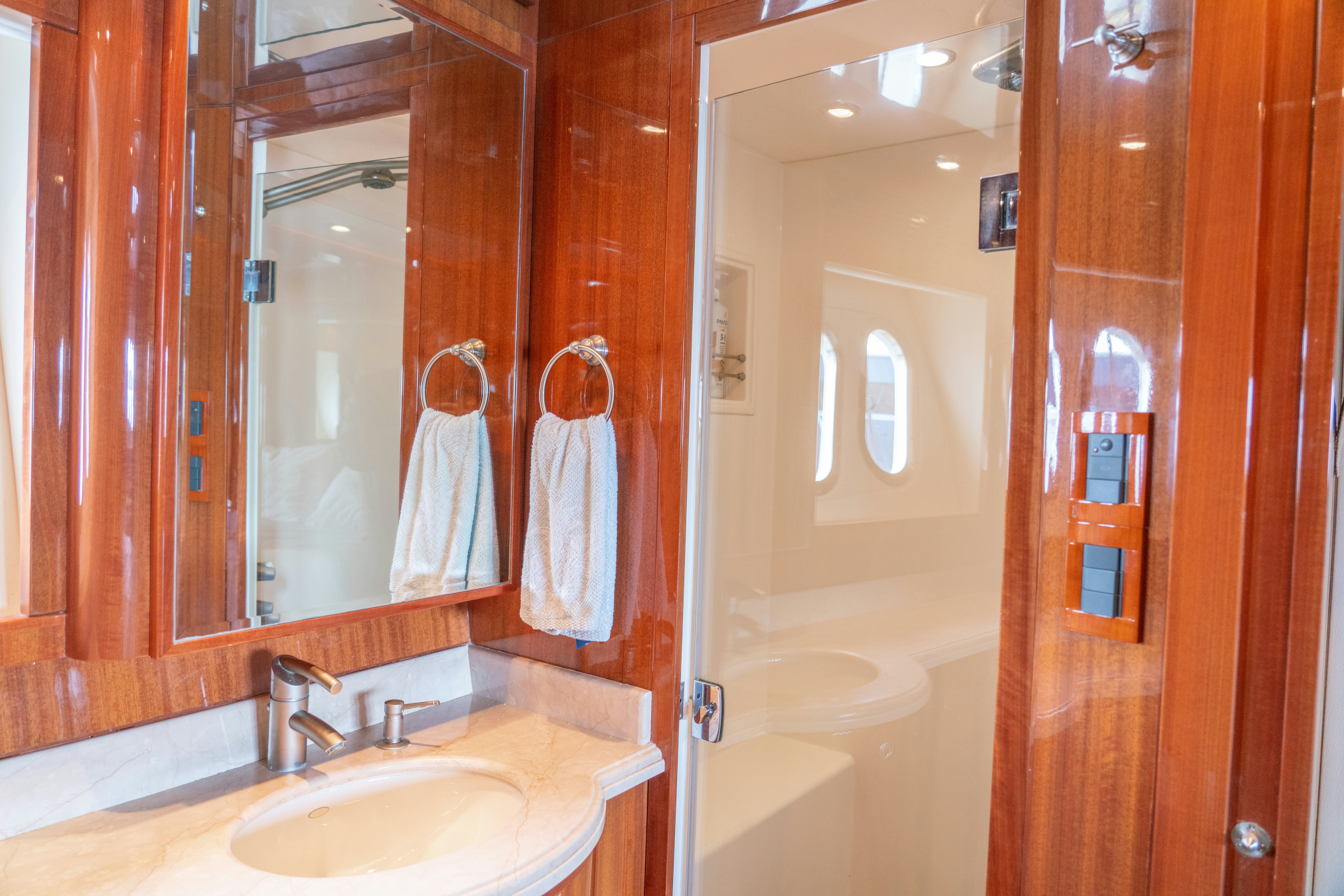 a bathroom with a sink and a mirror aboard YOLO Yacht for Sale