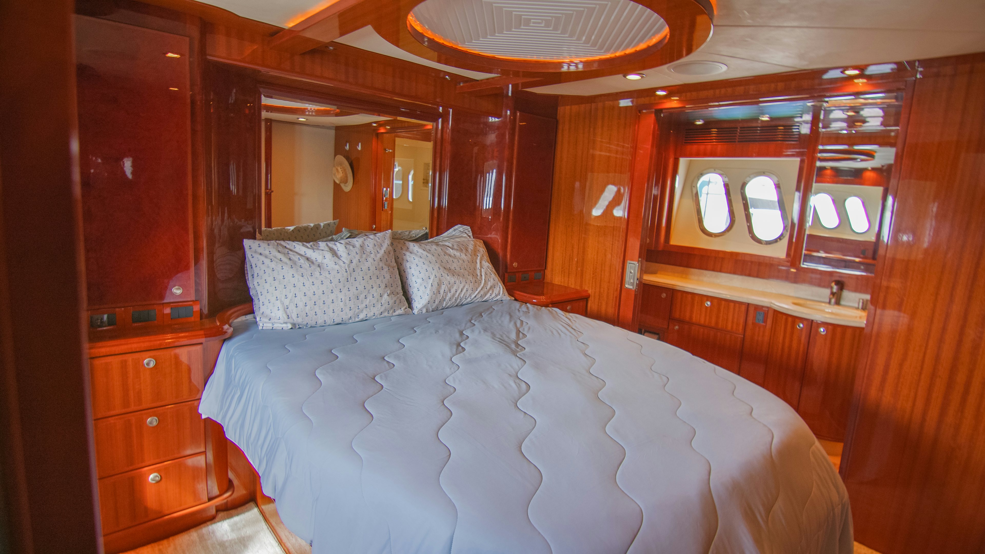 a bed in a room aboard YOLO Yacht for Sale
