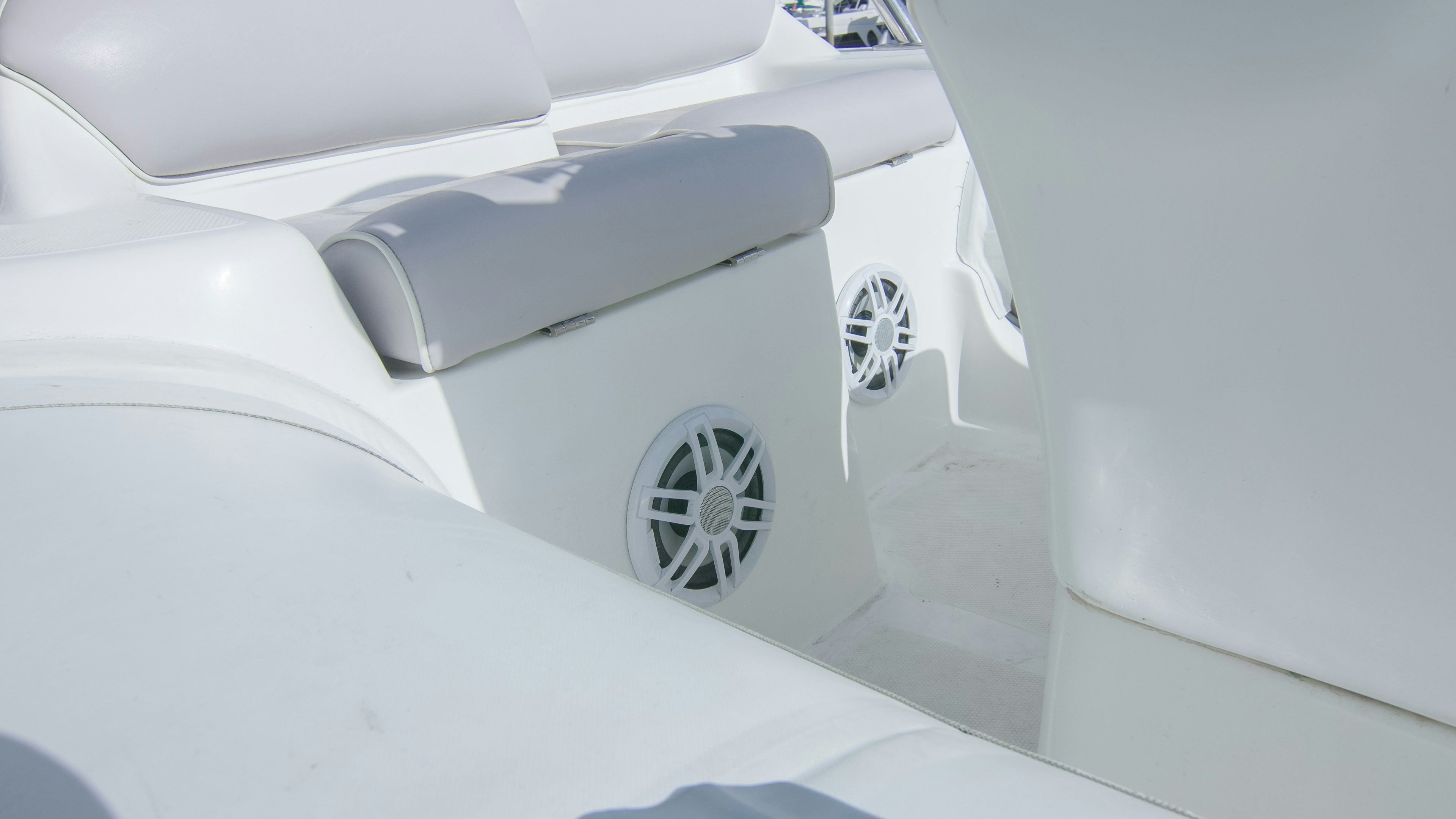 a white car with a logo on the front aboard YOLO Yacht for Sale