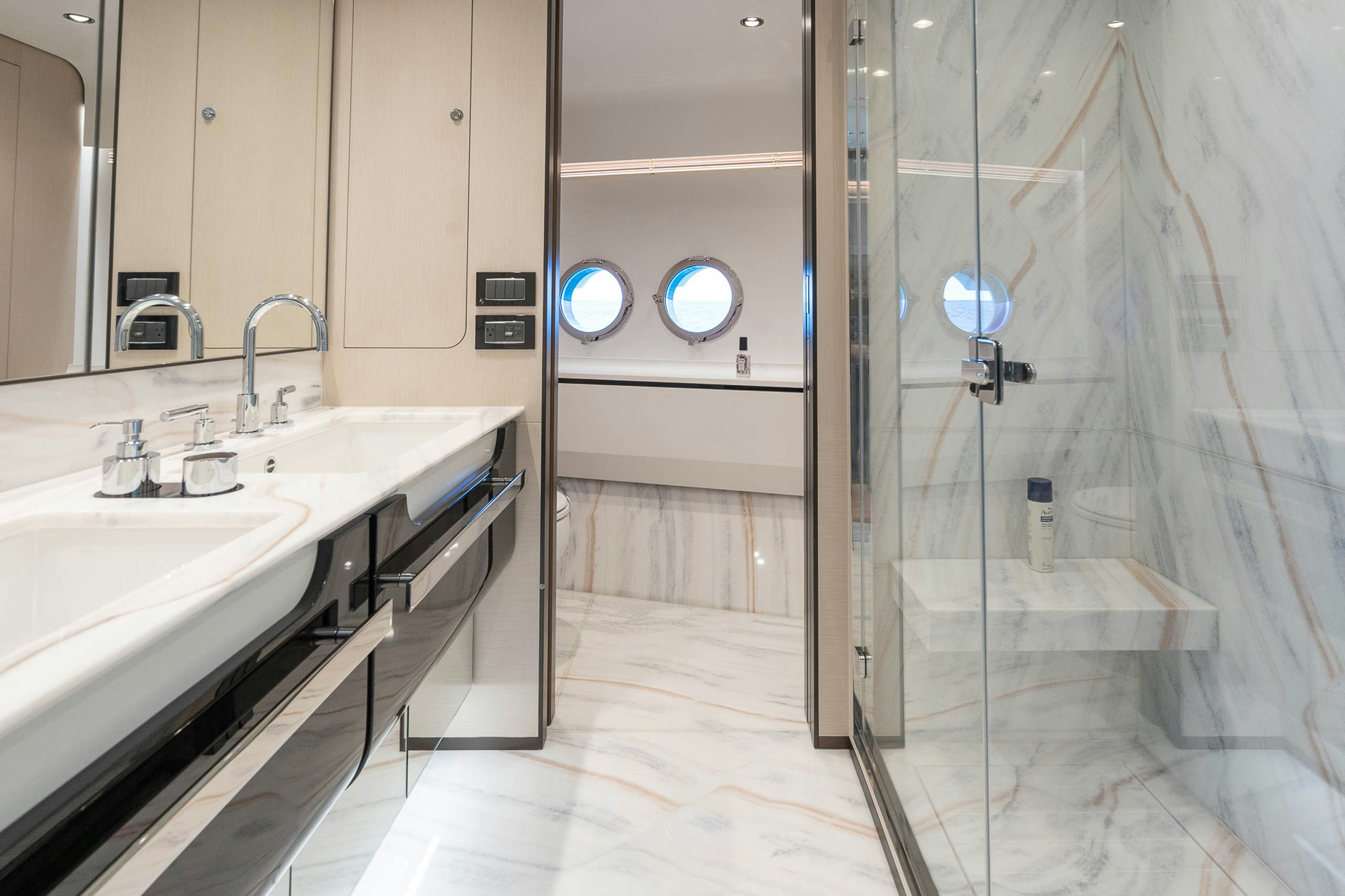 a bathroom with a glass shower aboard SEA OWL Yacht for Charter