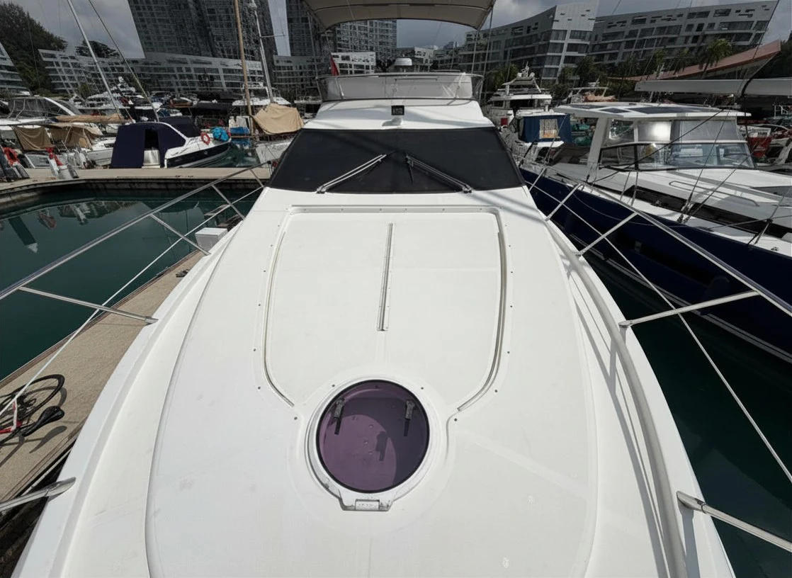 a white boat in a harbor aboard ROCK STAR DREAMS Yacht for Sale