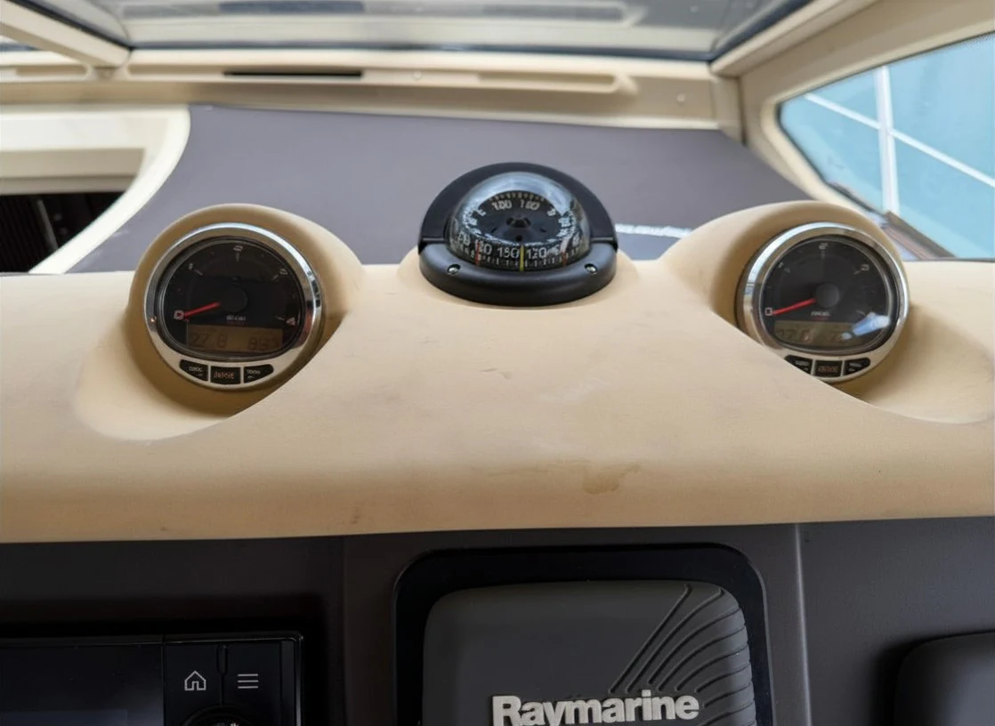the steering wheel and dashboard of a car aboard ROCK STAR DREAMS Yacht for Sale