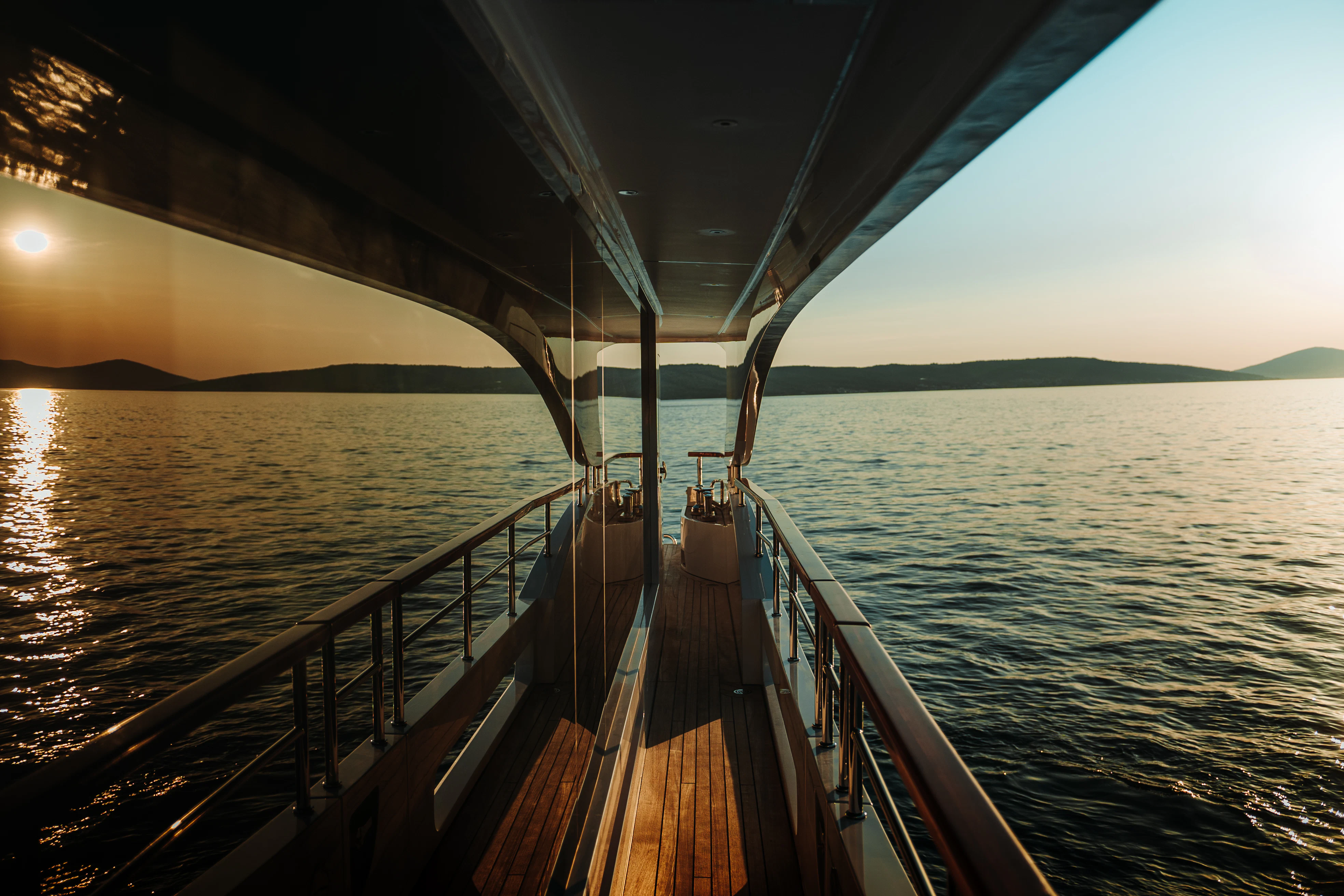 a wooden dock over water aboard BELLA VITA Yacht for Charter