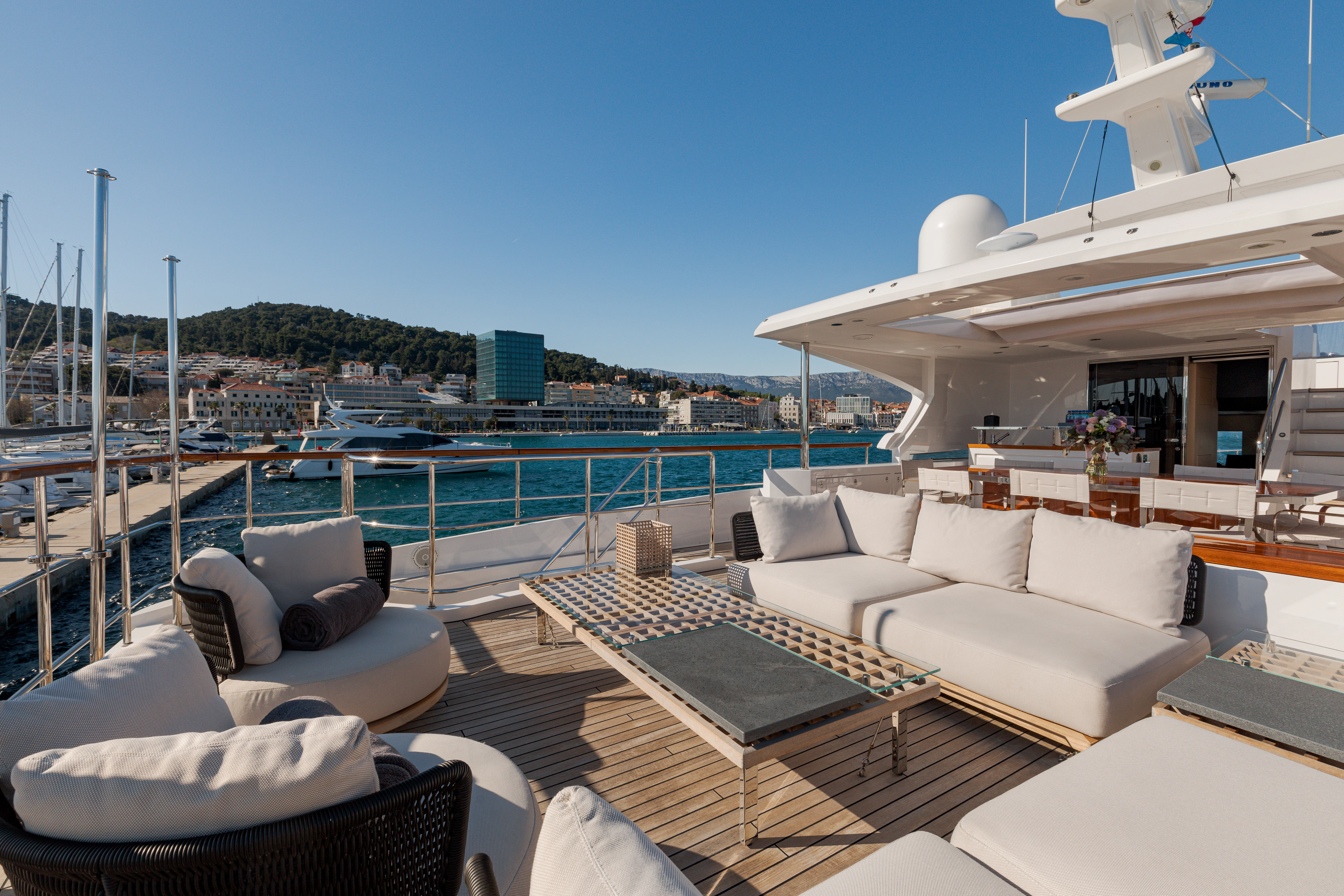a large lounge area with a large deck and a large pool aboard BELLA VITA Yacht for Charter