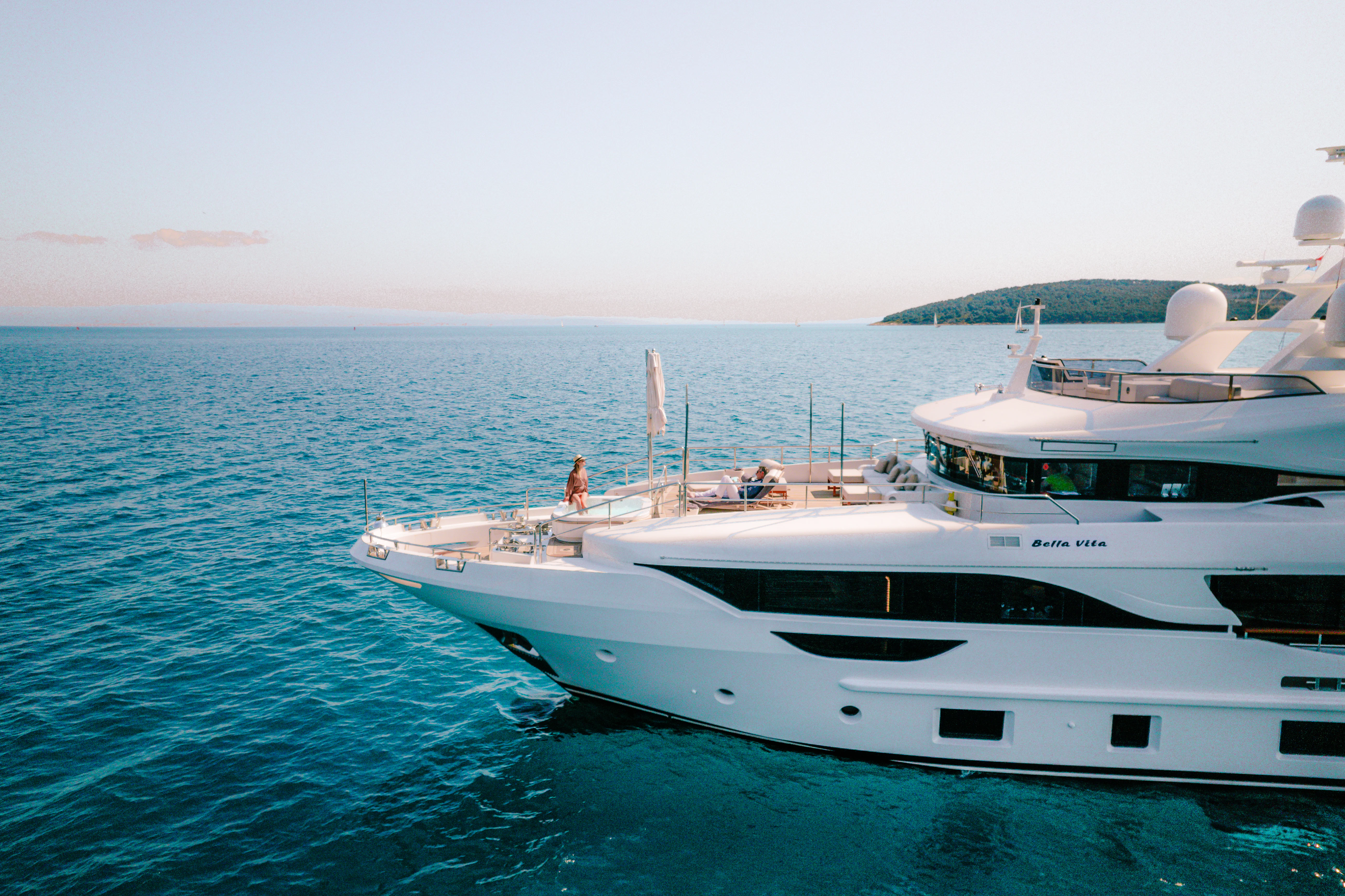 a couple of white yachts in the water aboard BELLA VITA Yacht for Charter
