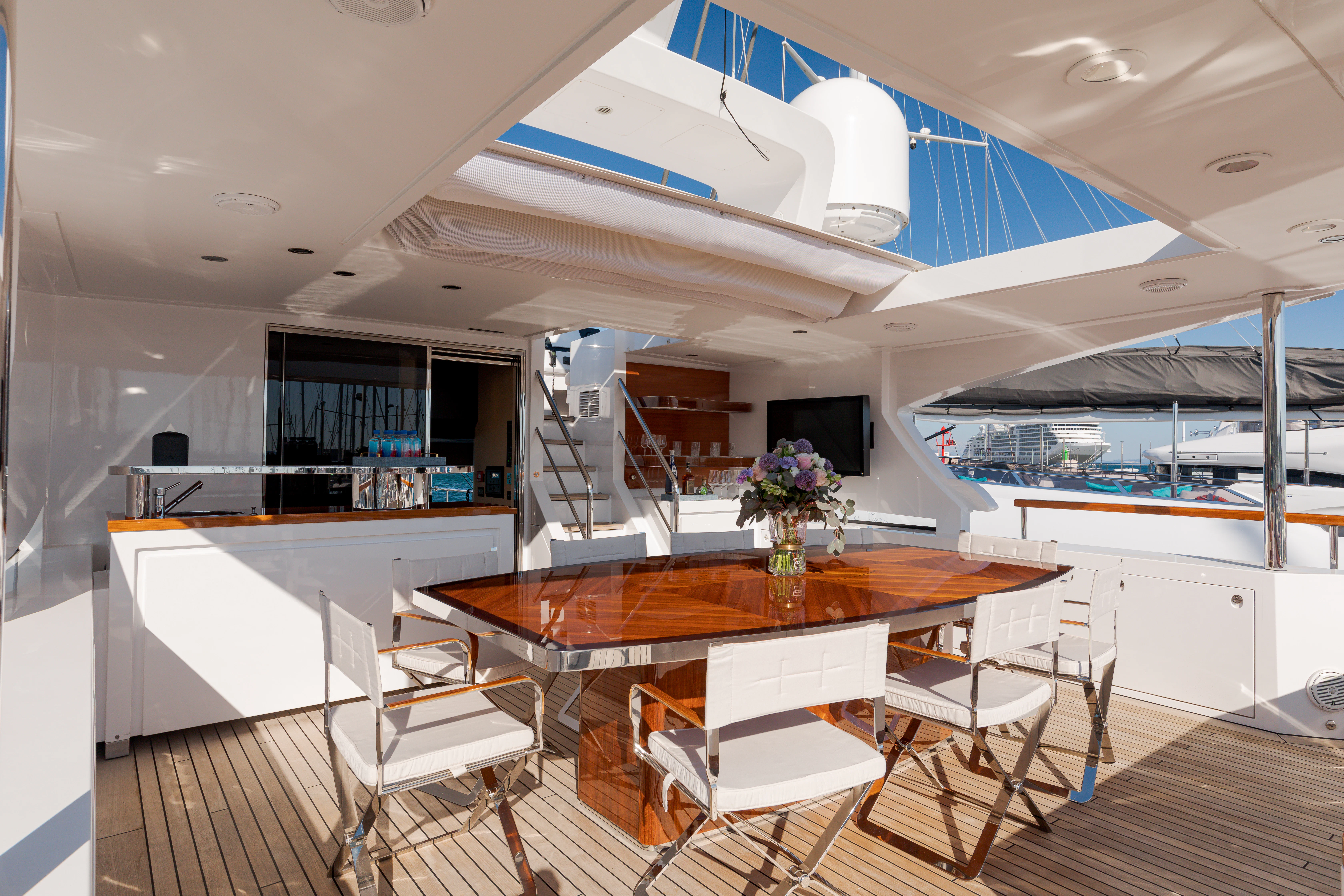 a room with a table and chairs aboard BELLA VITA Yacht for Charter