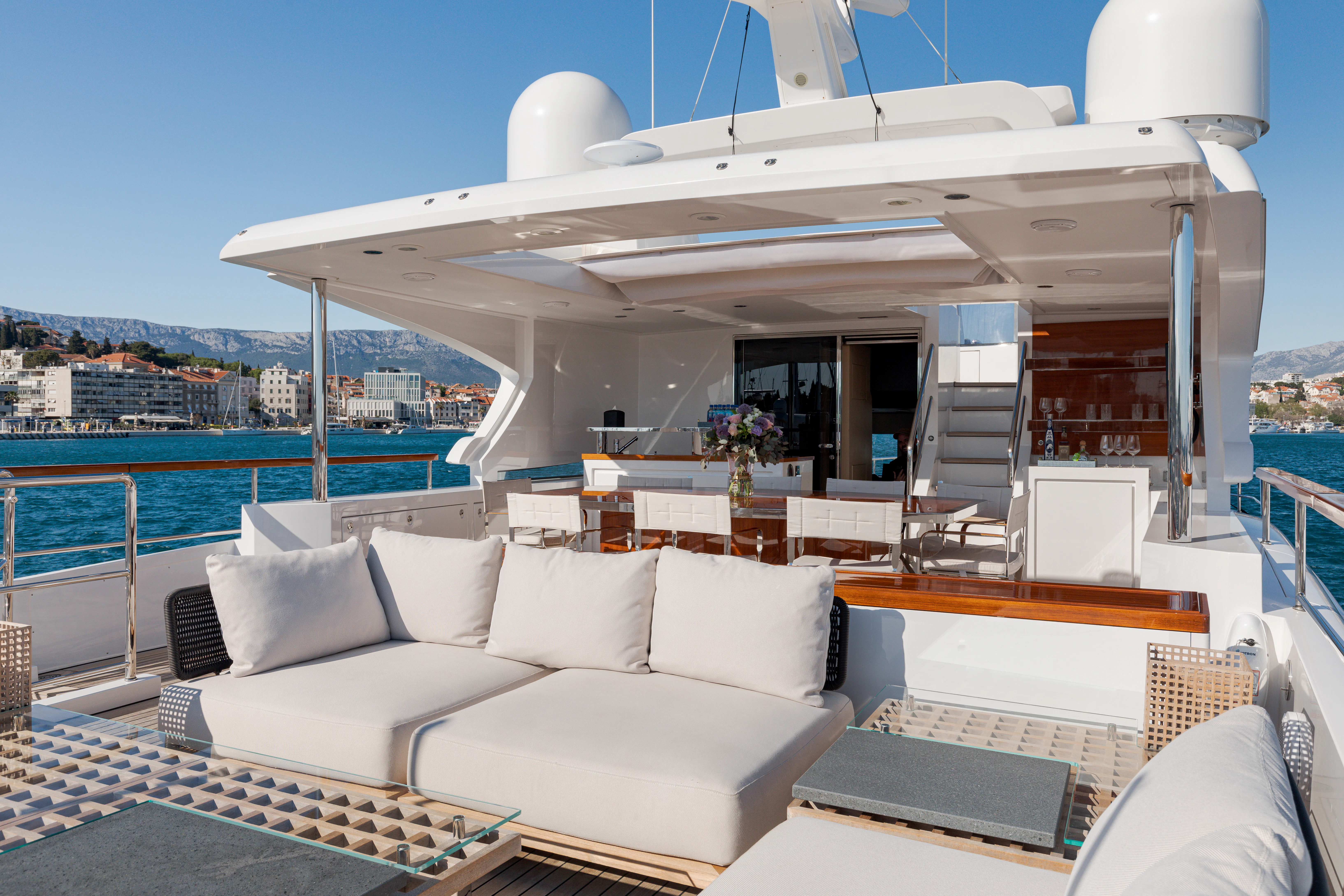 a living room with a large balcony aboard BELLA VITA Yacht for Charter