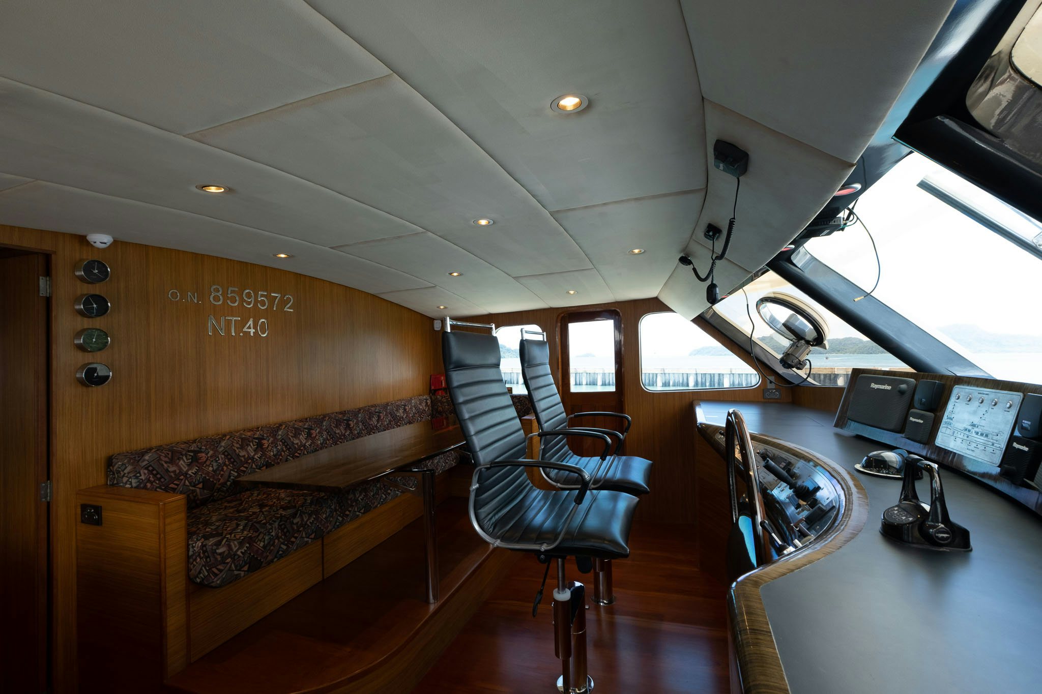 a room with a couch and a desk aboard THEA Yacht for Sale
