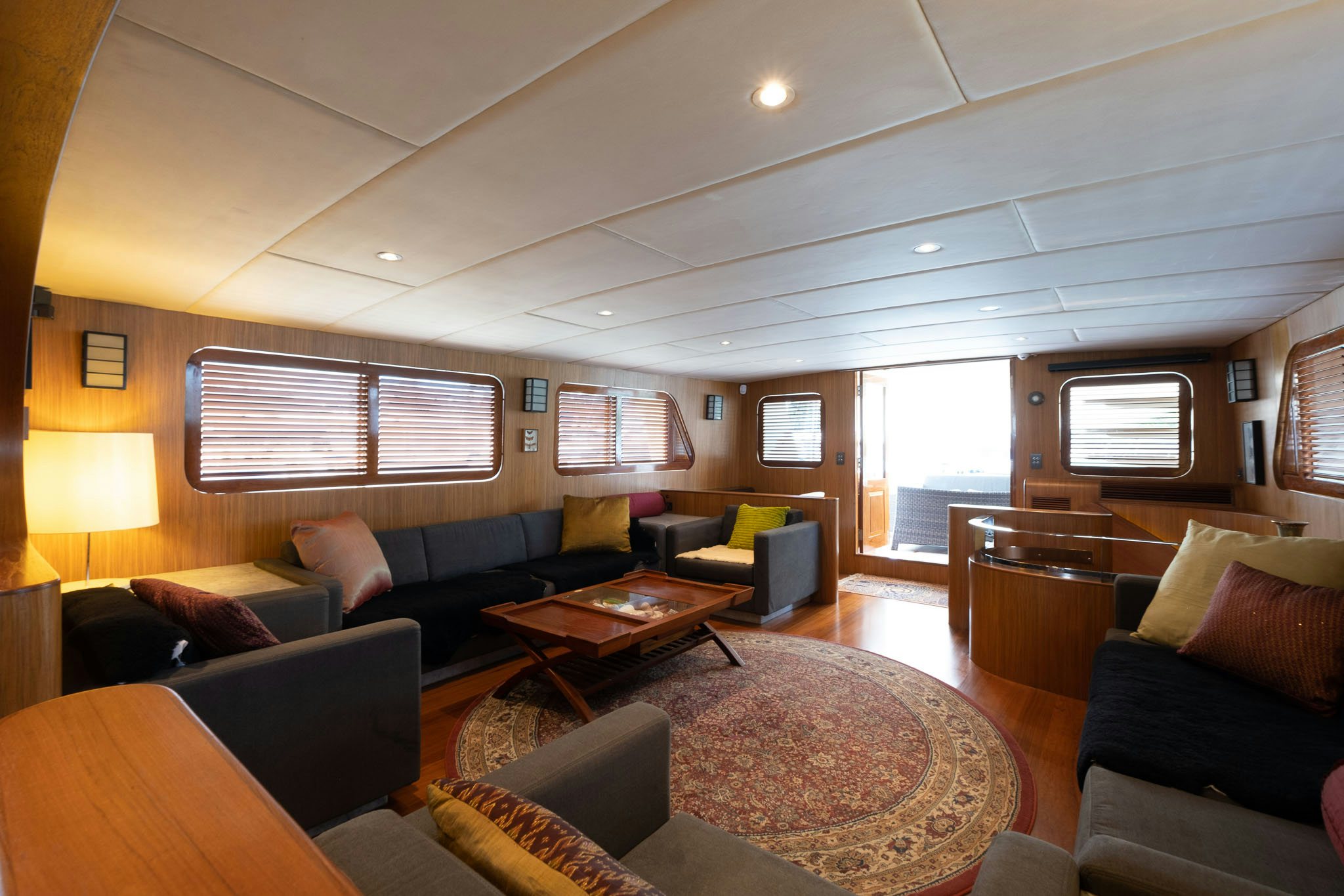 a living room with a couch and a coffee table aboard THEA Yacht for Sale
