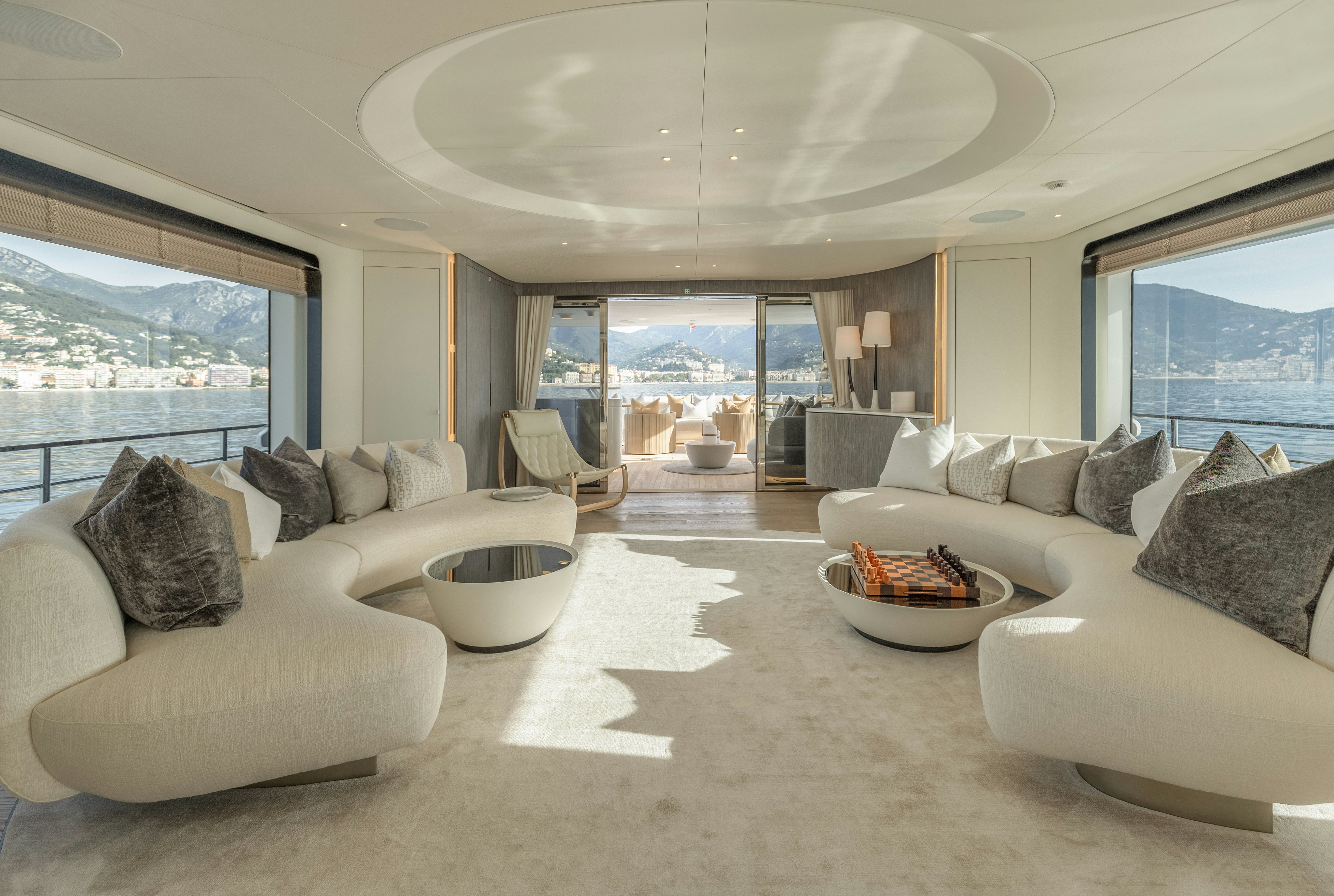 a living room with a large window aboard H Yacht for Sale