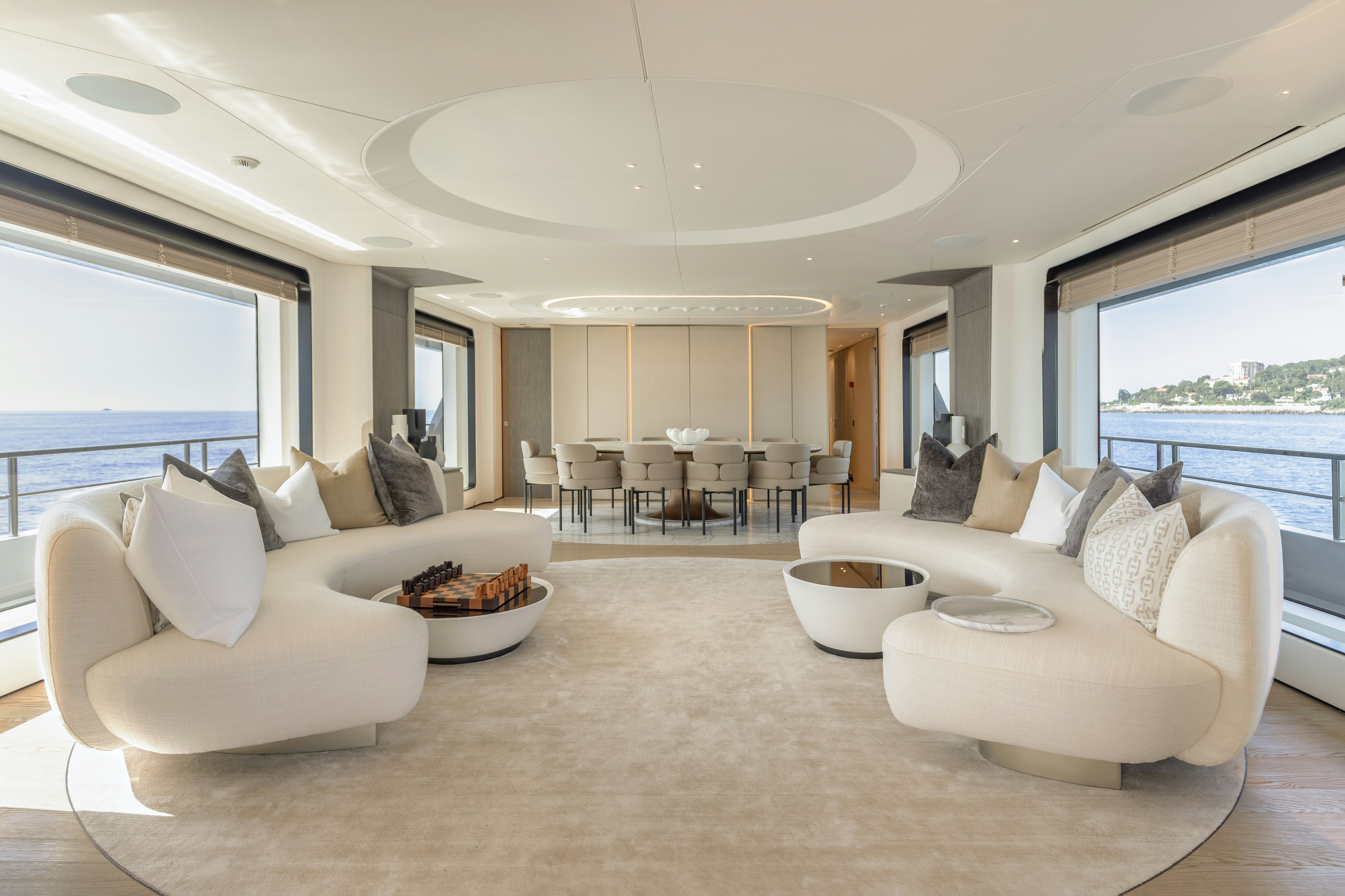 a living room with a large window aboard H Yacht for Sale