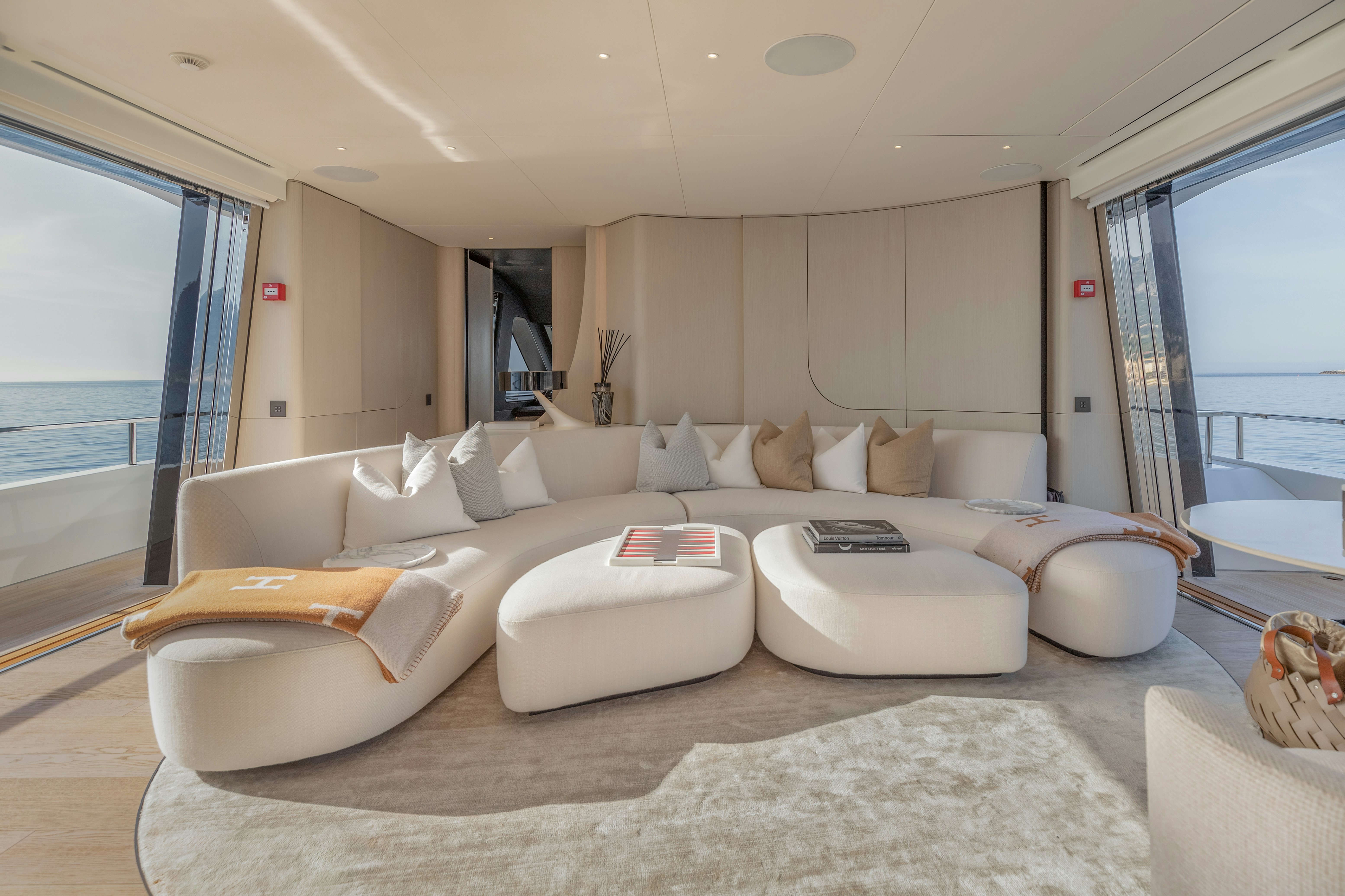a large white couch in a room aboard H Yacht for Sale