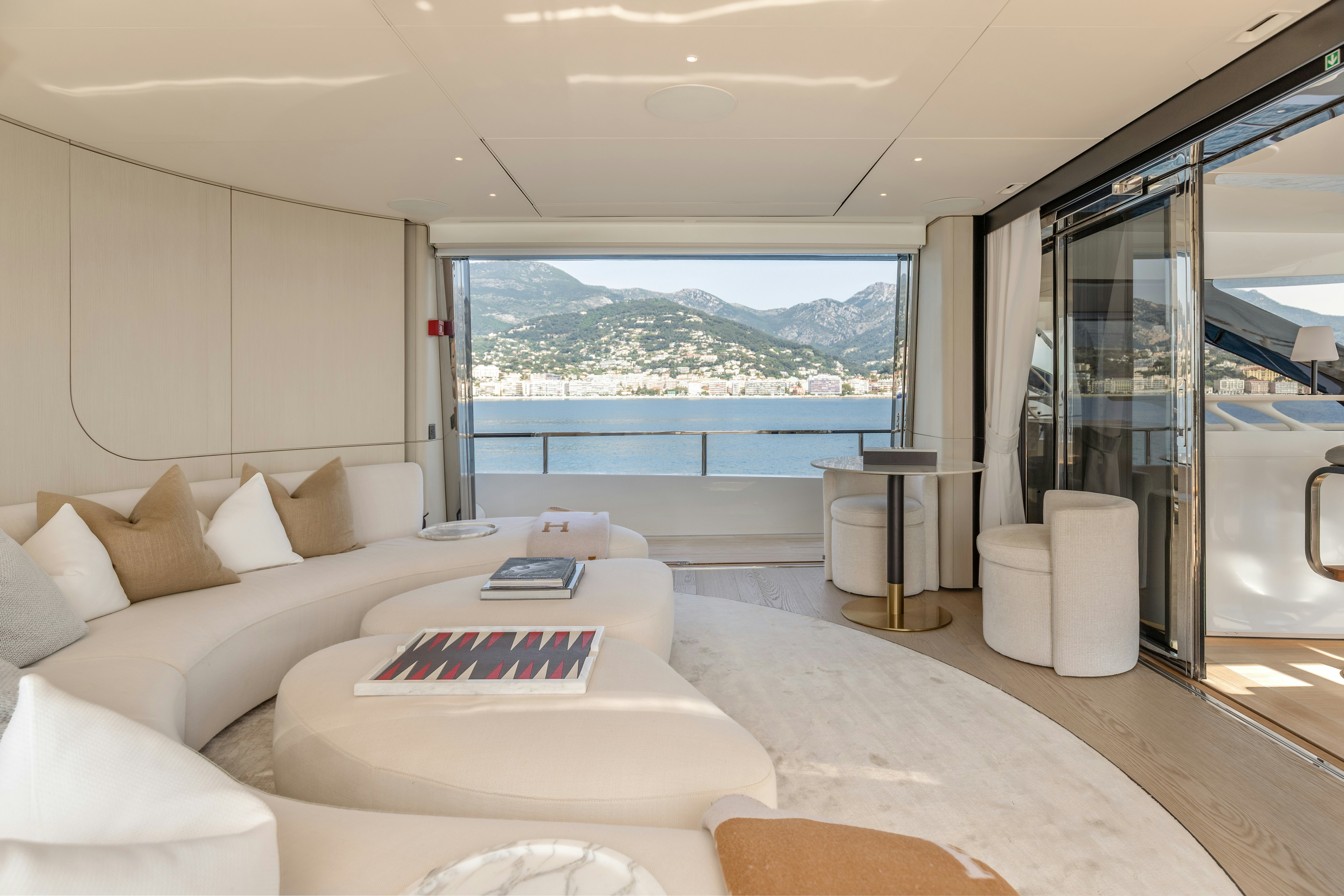 a room with a bed and a large window aboard H Yacht for Sale