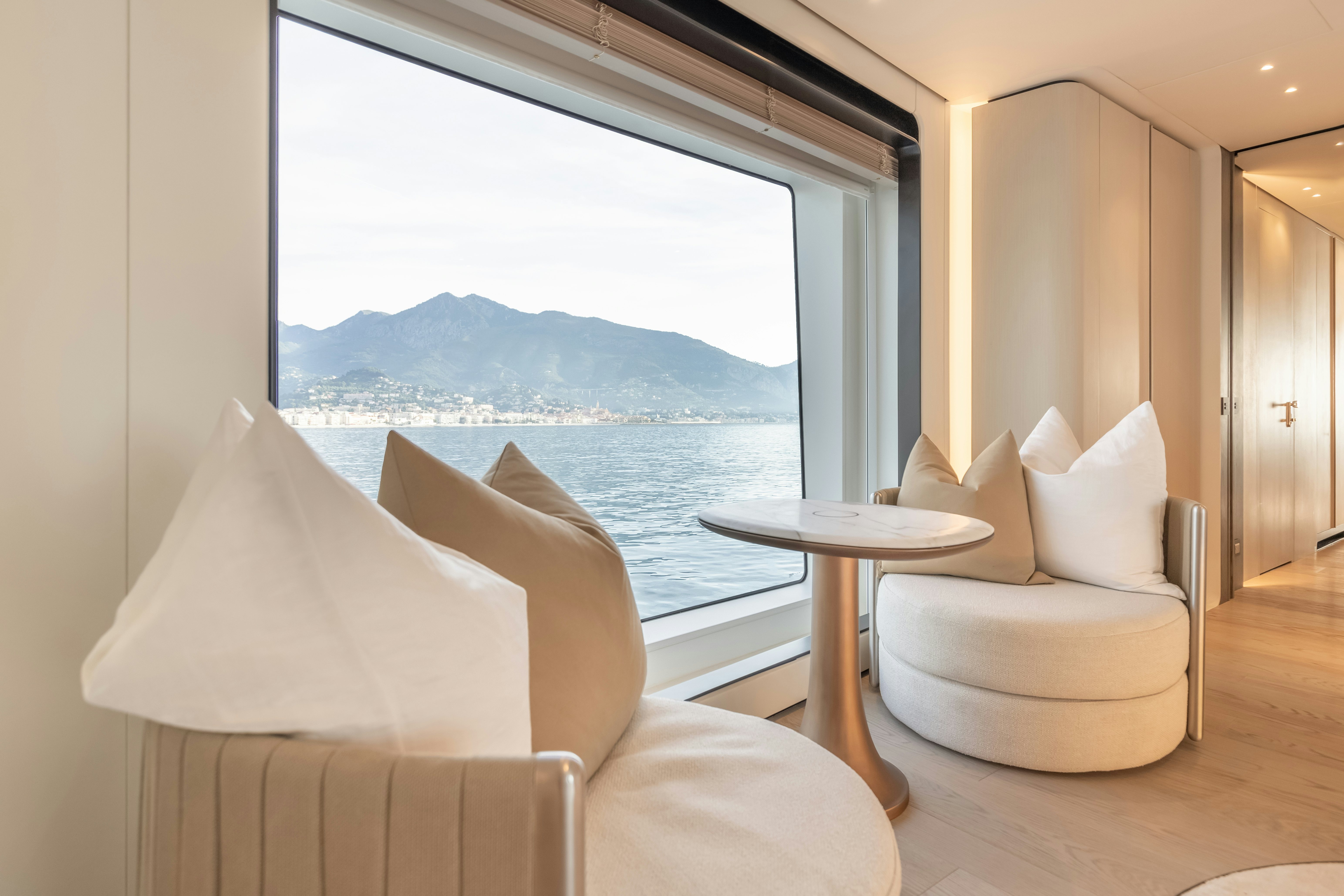 a room with a table and chairs aboard H Yacht for Sale