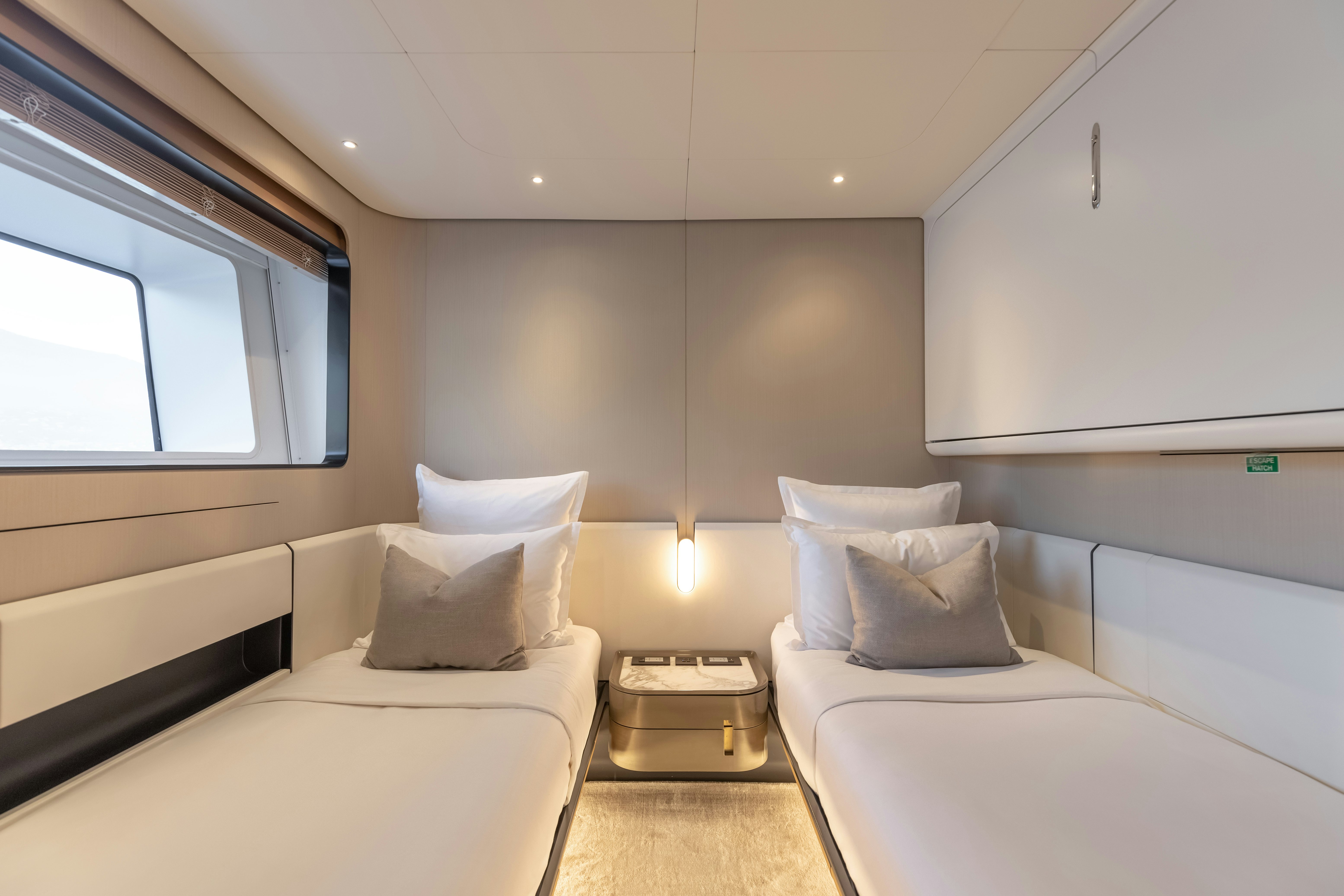 a room with white beds aboard H Yacht for Sale