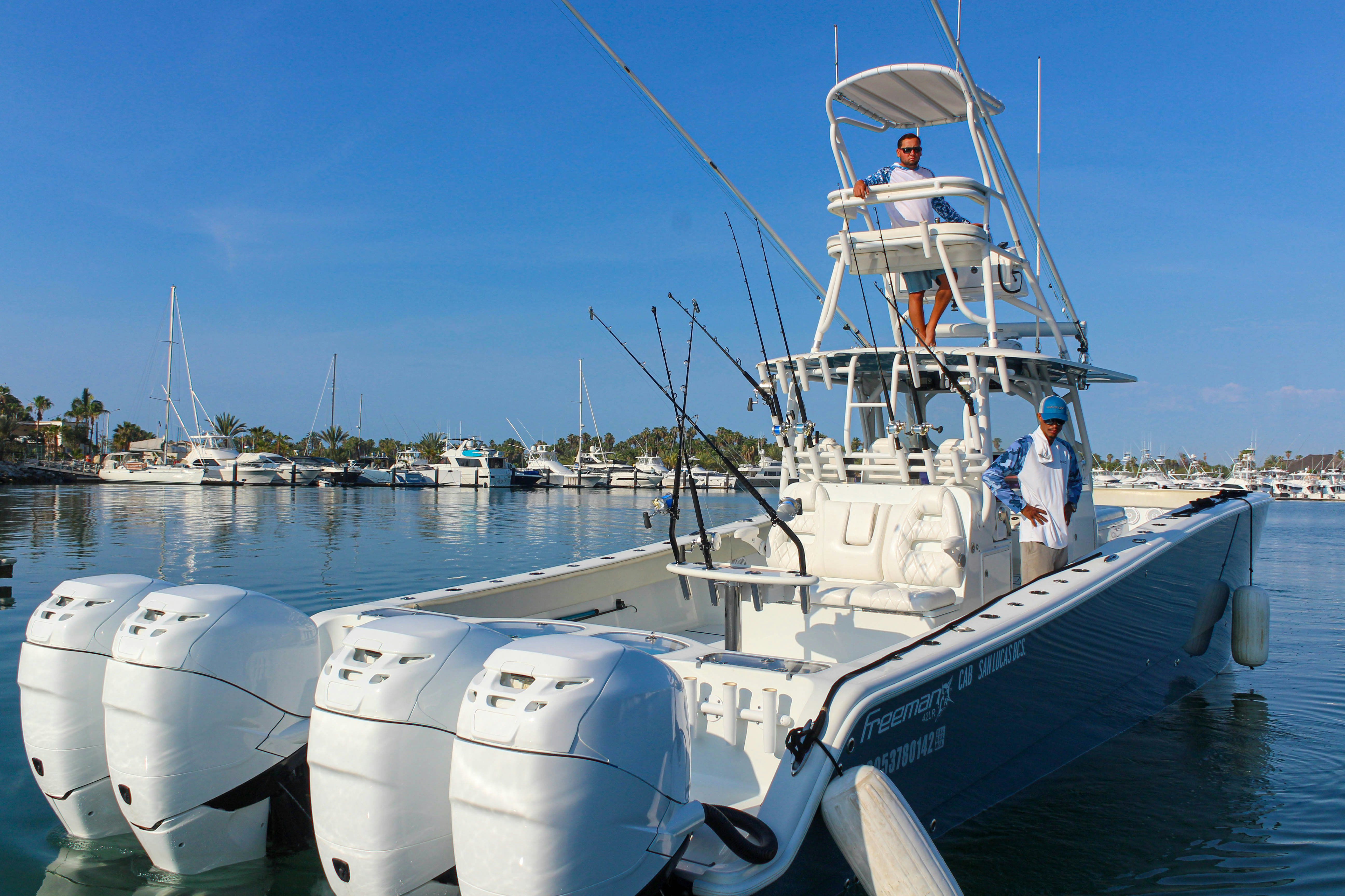 a couple of men on a boat aboard LET'S GO Yacht for Sale